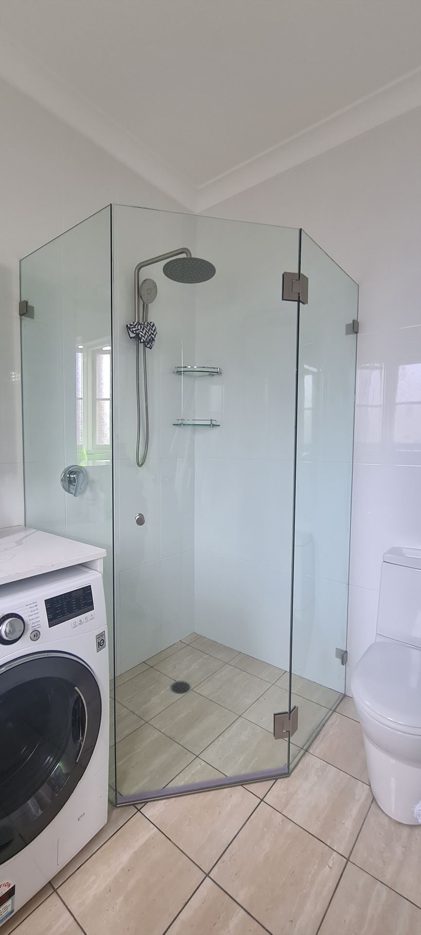 frameless shower screen with chrome hardware installed in Strathfield by Showerland