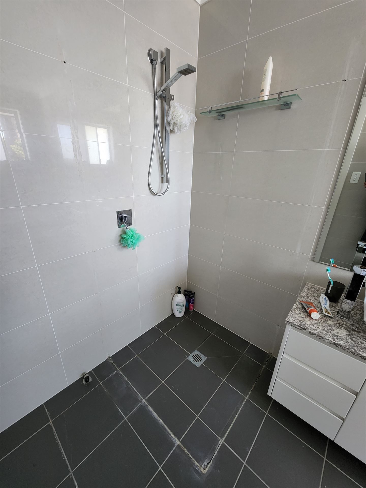 Bathroom before frameless shower screen install in Kingsgrove