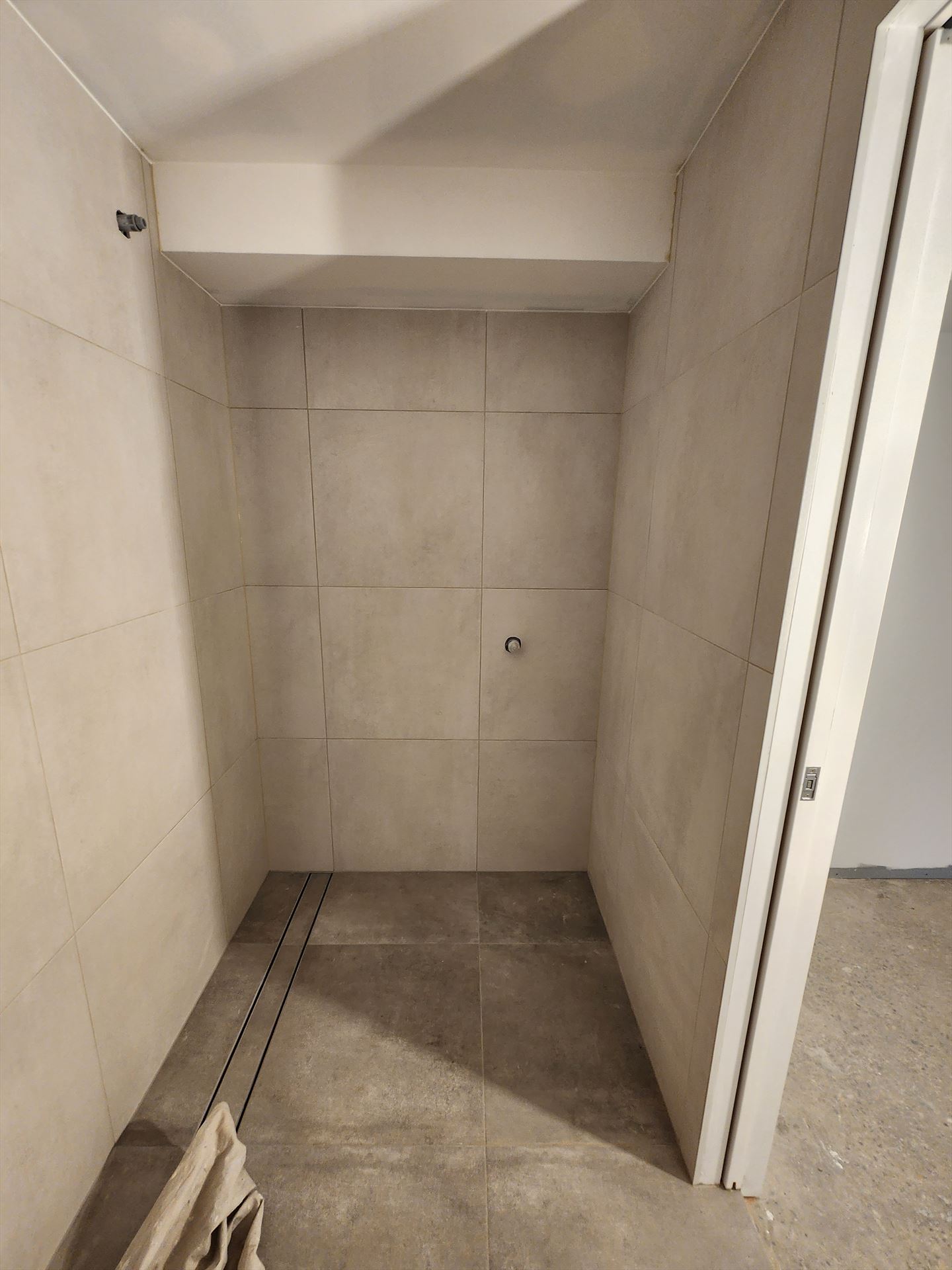 Bathroom before frameless shower screen install in Revesby