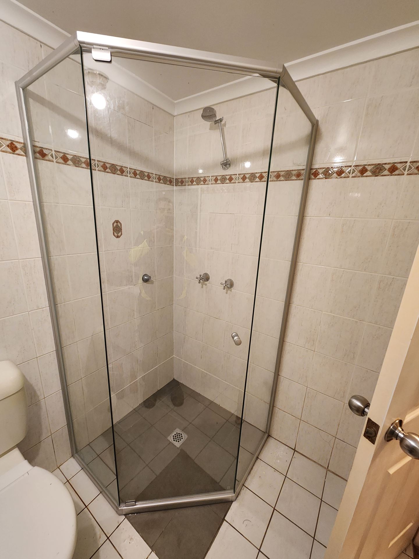 shower screen with chrome hardware installed in Riverwood by Showerland