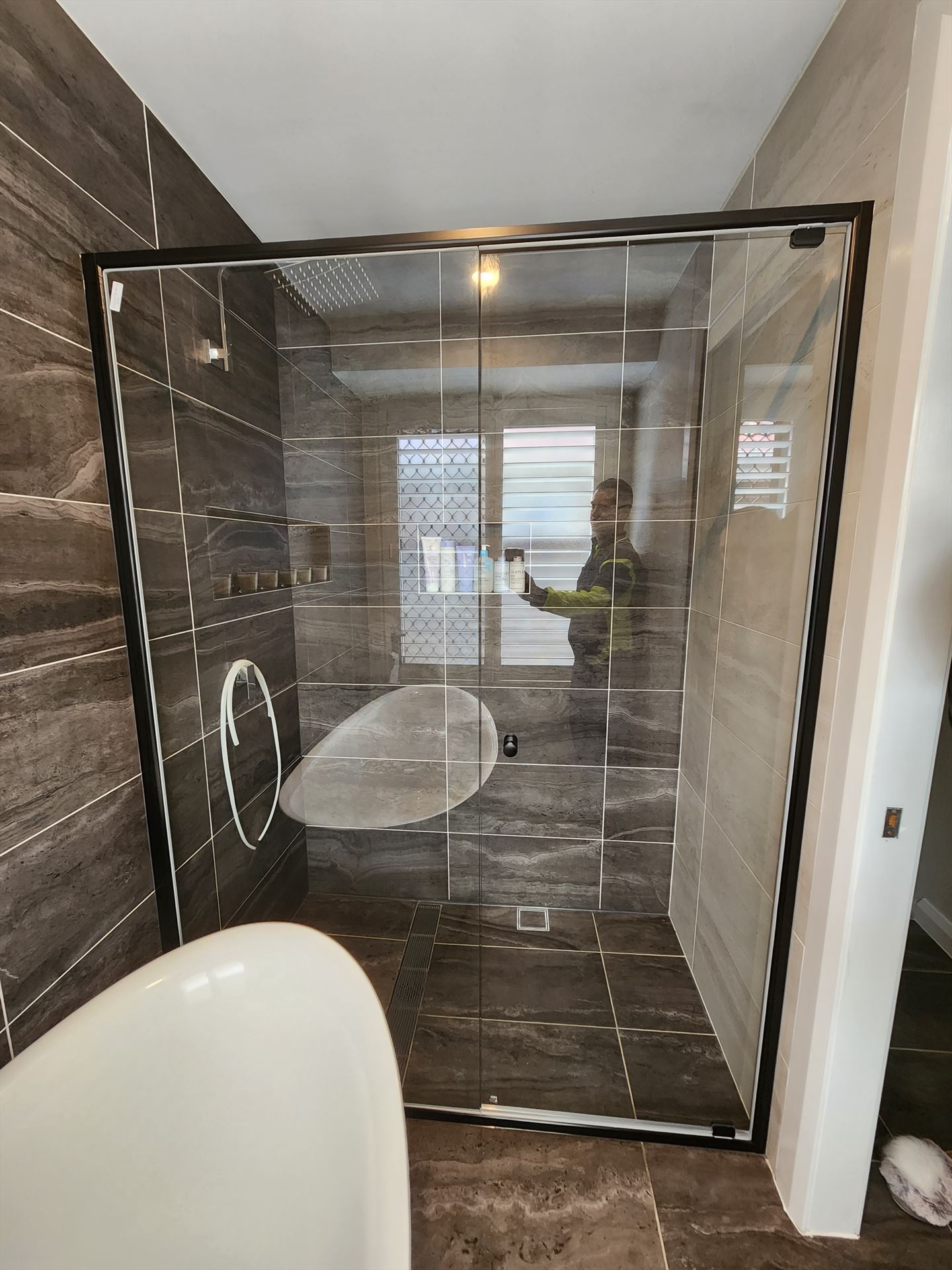 semi shower screen with black hardware installed in Woodcroft by Showerland
