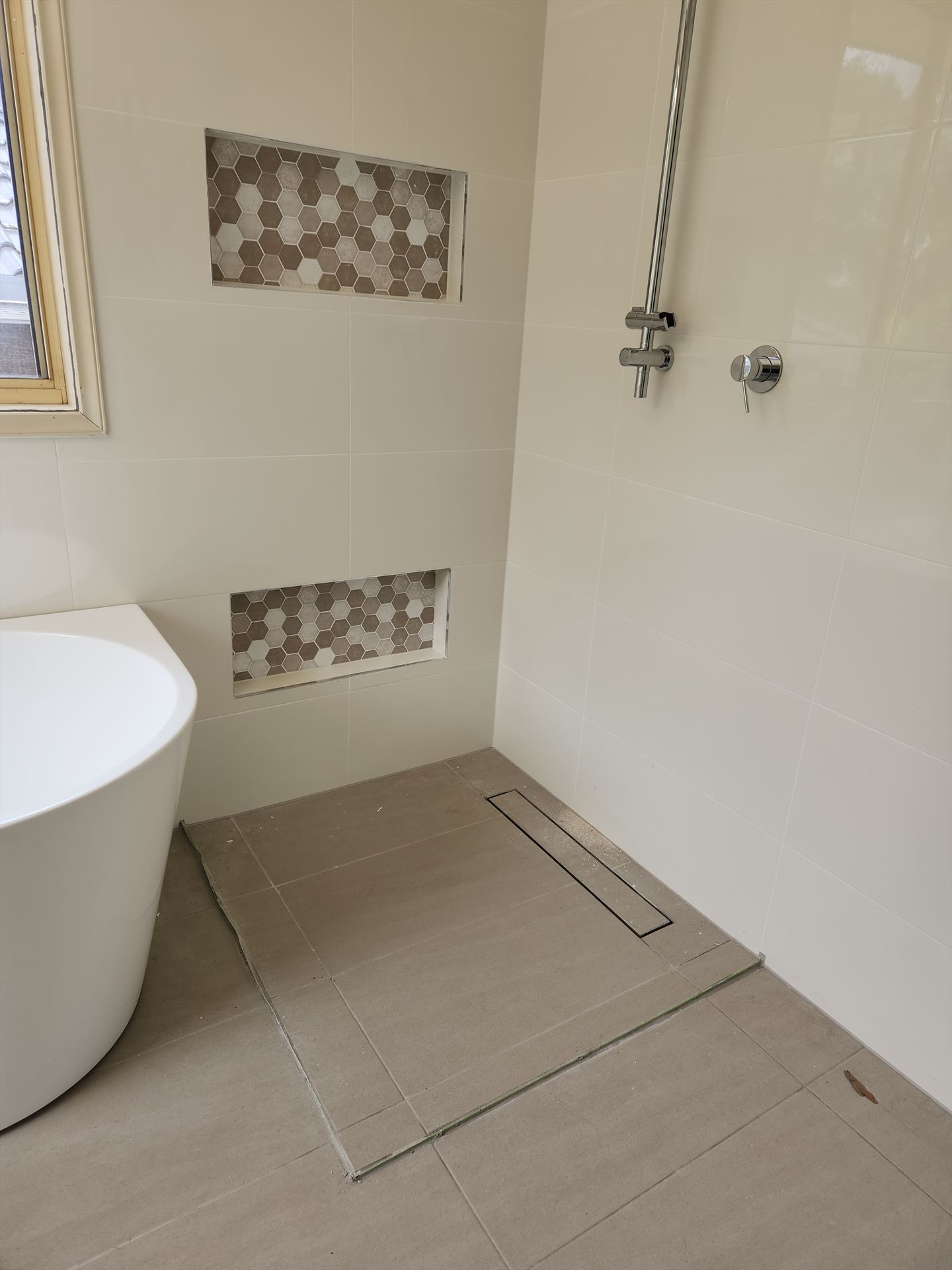 Bathroom before frameless shower screen install in Casula