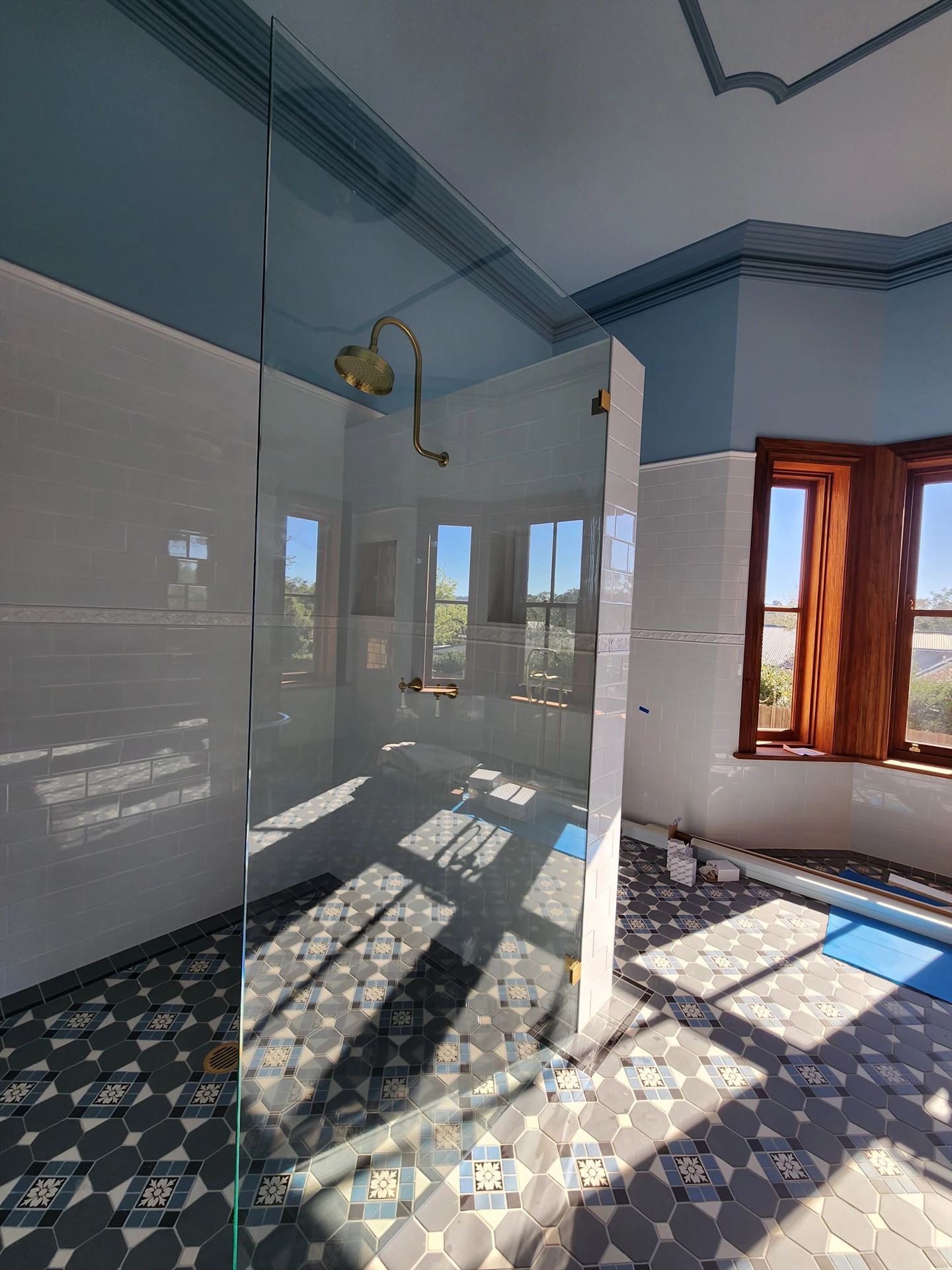 frameless shower screen with gold hardware installed in Wallacia by Showerland