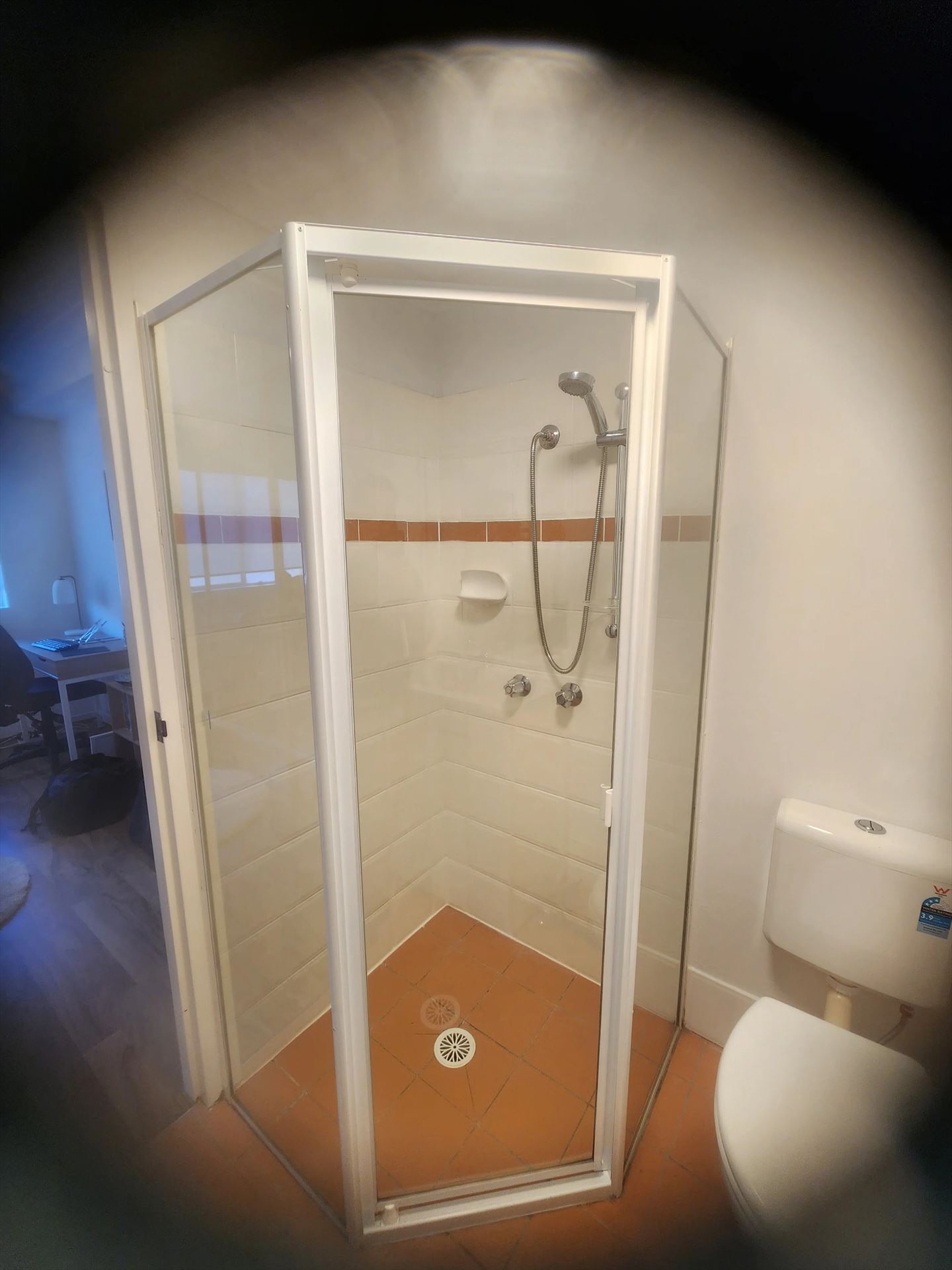 fully shower screen with white hardware installed in Hornsby by Showerland