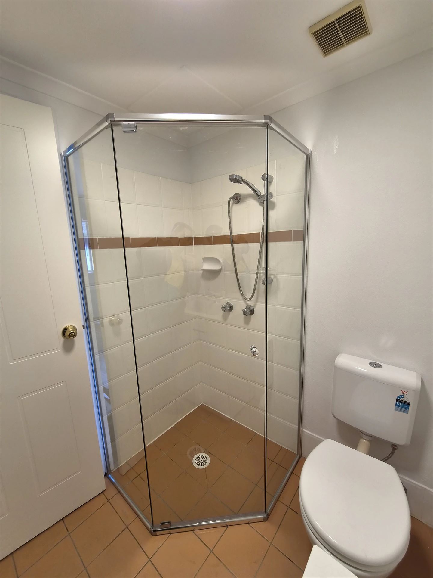 semi shower screen with chrome hardware installed in Hornsby by Showerland