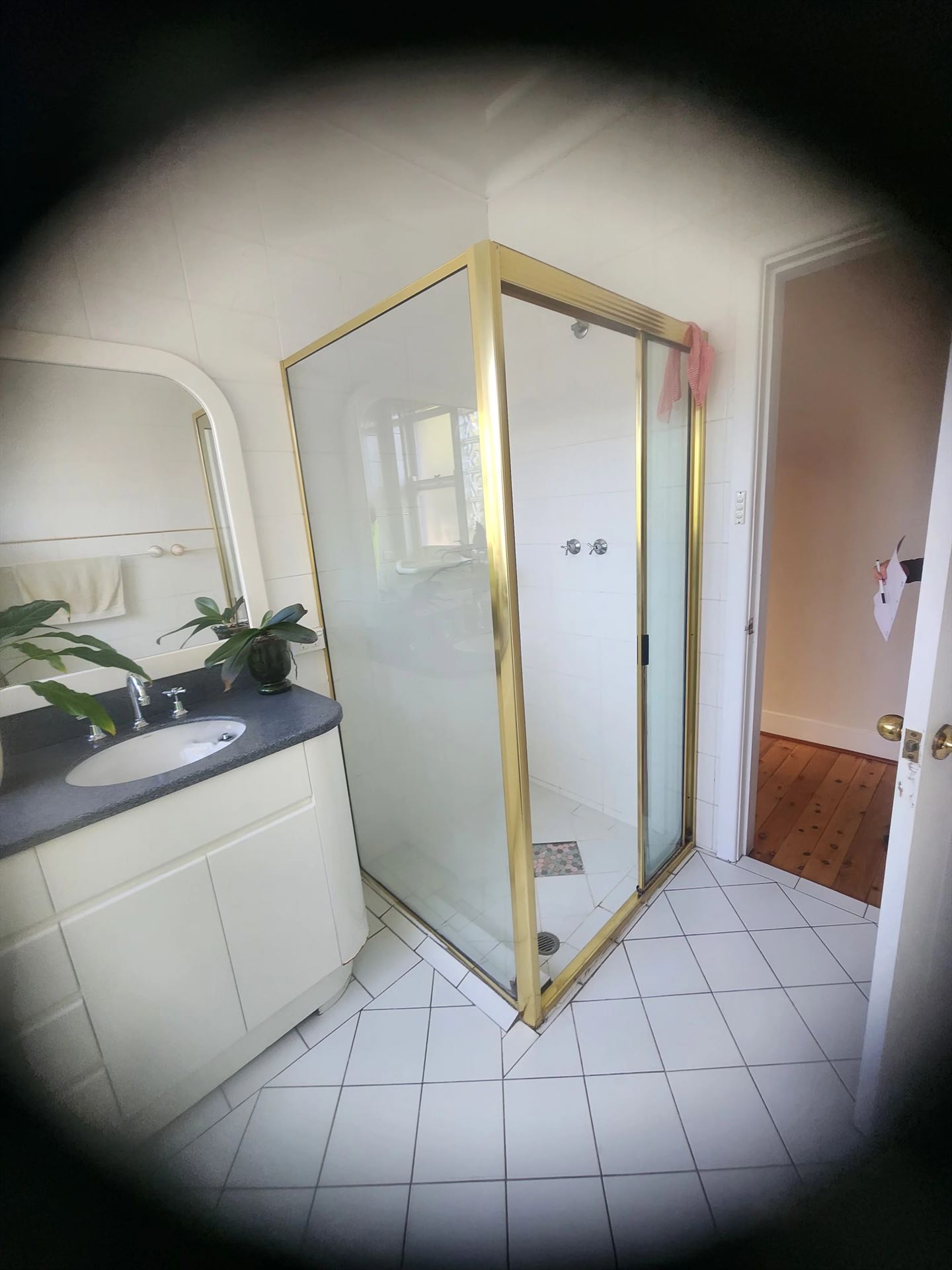 fully shower screen with gold hardware installed in Killara by Showerland