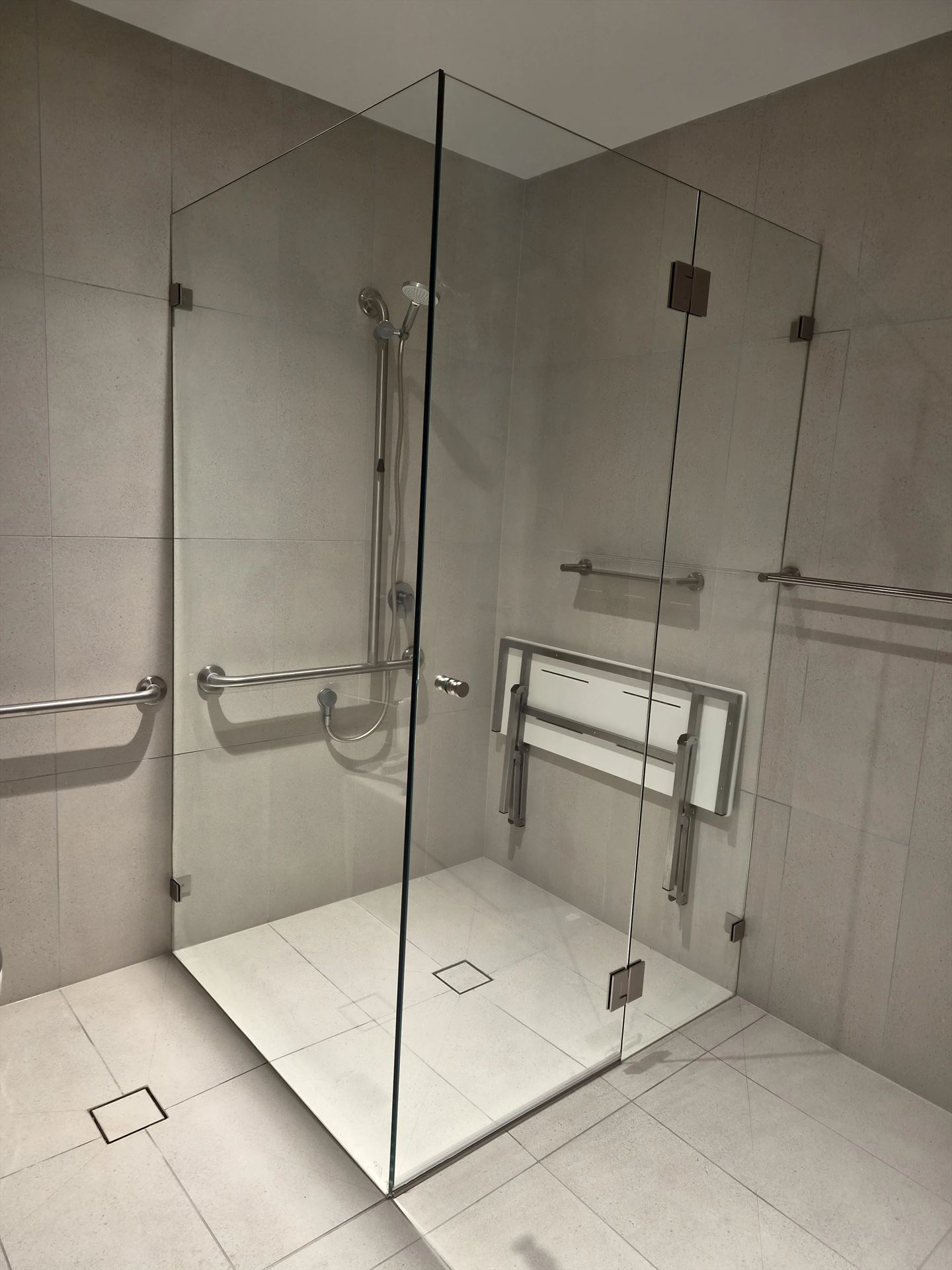 frameless shower screen with chrome hardware installed in Epping by Showerland