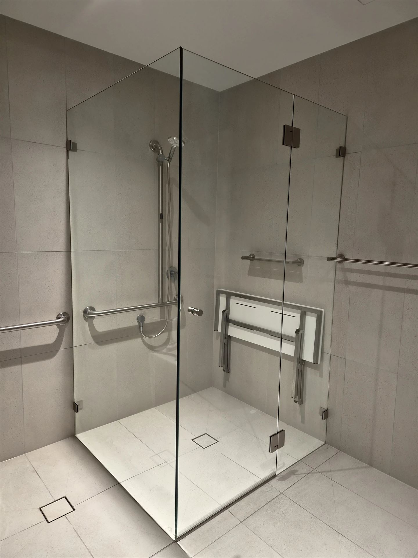 frameless shower screen with chrome hardware installed in Epping by Showerland