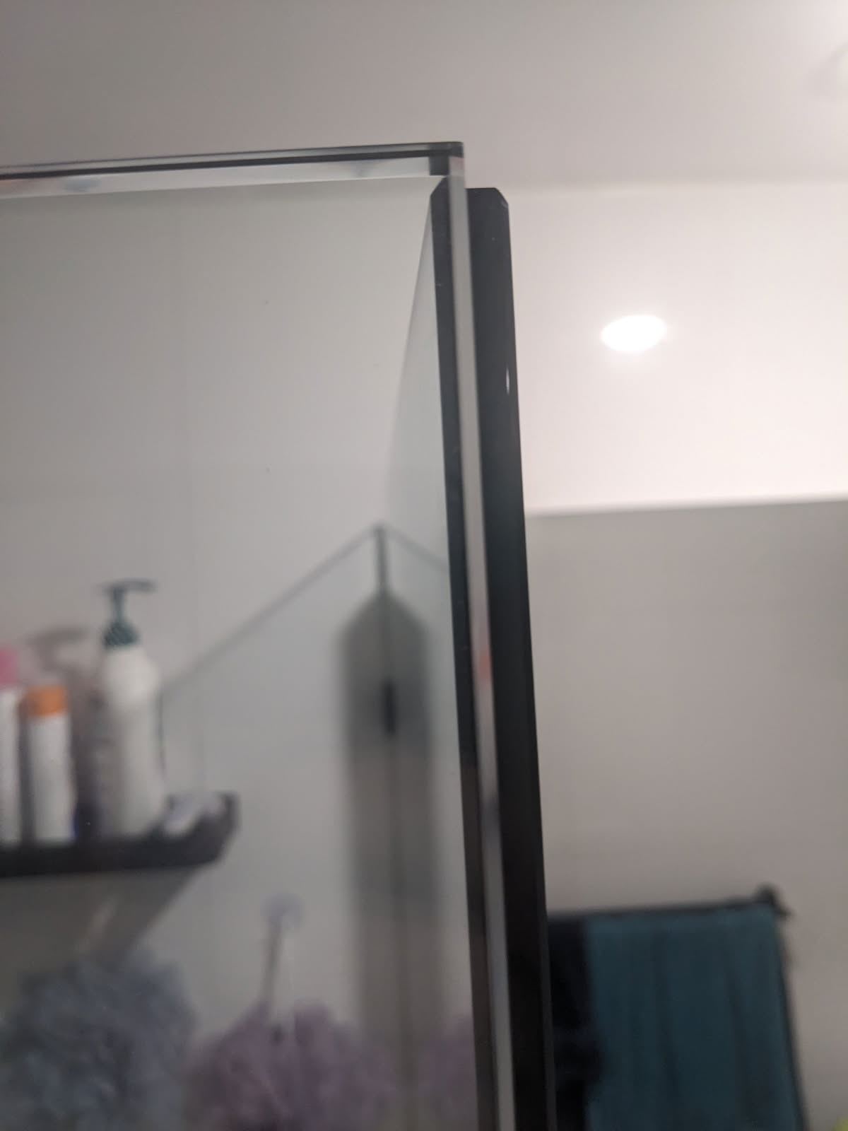 frameless shower screen with black hardware installed in Kings Park by Showerland