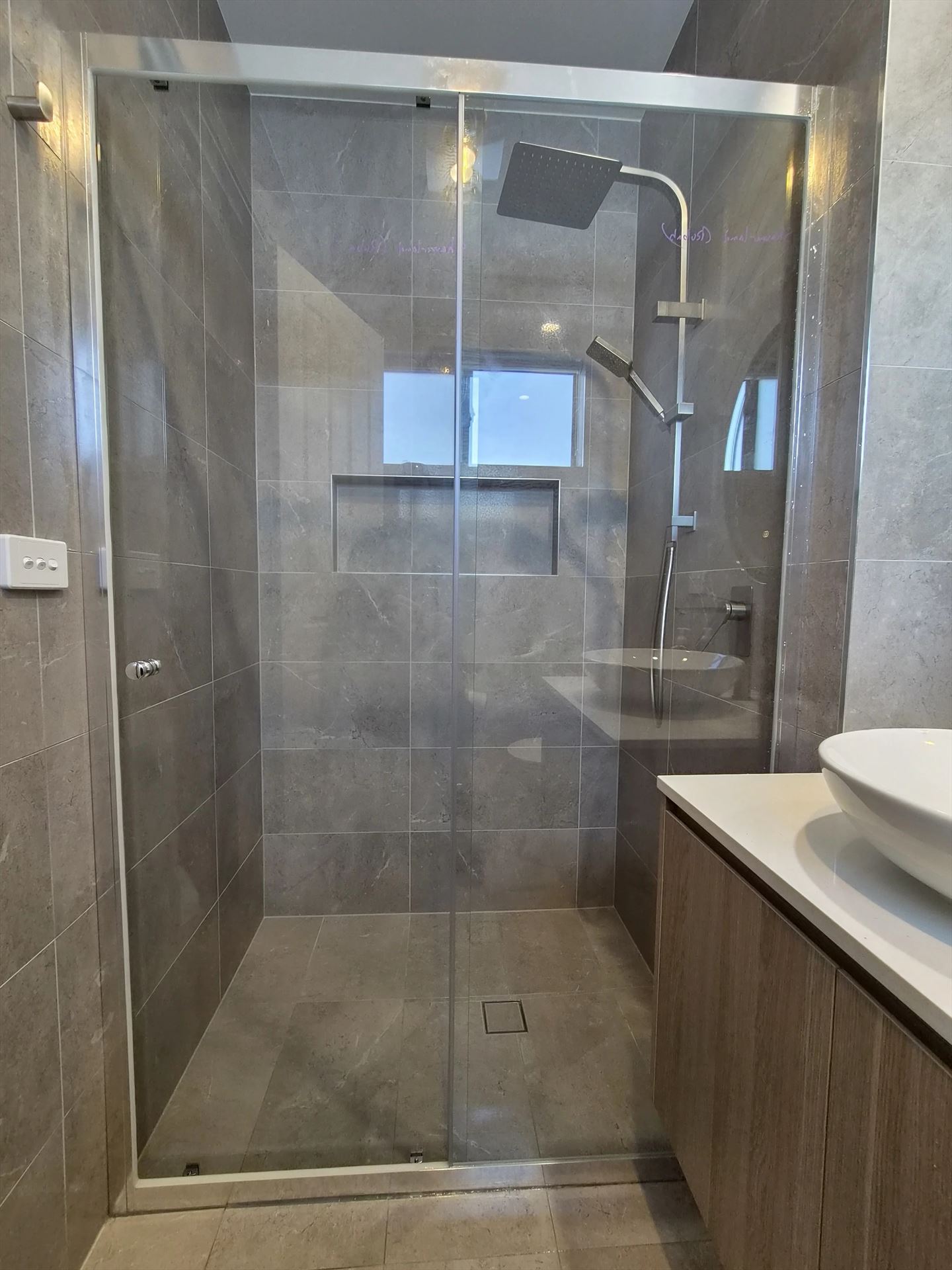 semi shower screen with chrome hardware installed in Box Hill by Showerland