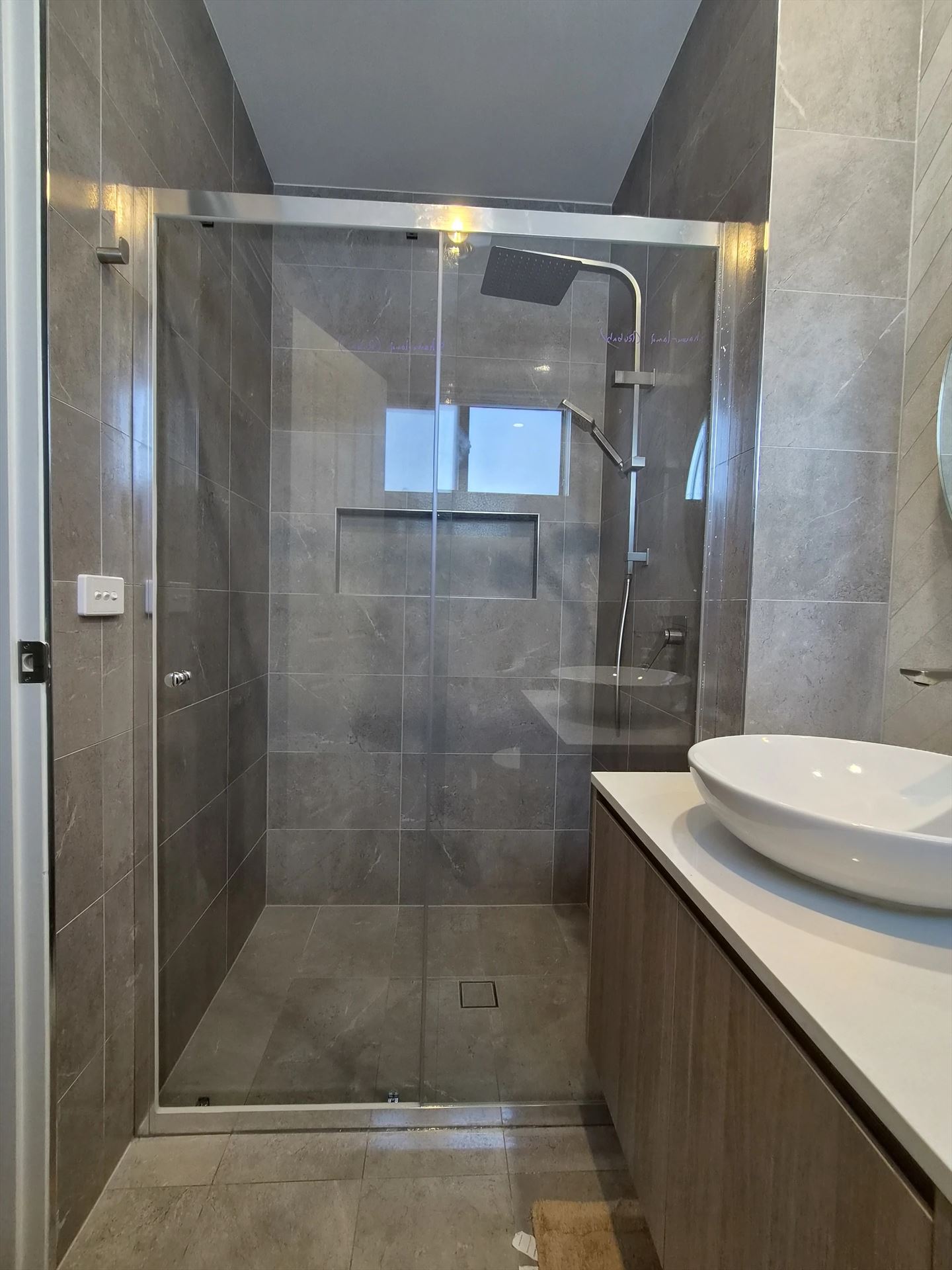 semi shower screen with chrome hardware installed in Box Hill by Showerland