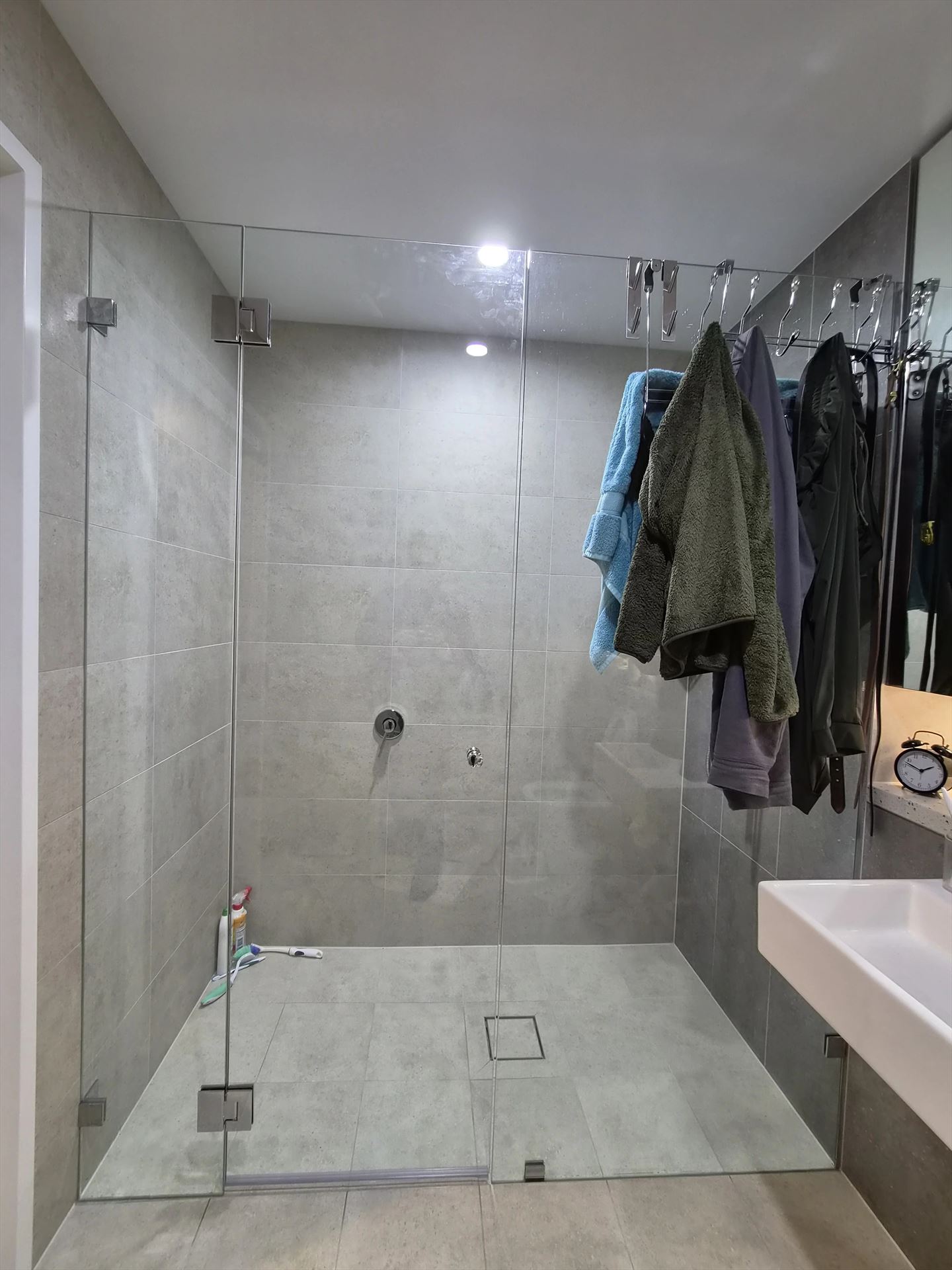 frameless shower screen with chrome hardware installed in Rouse Hill by Showerland