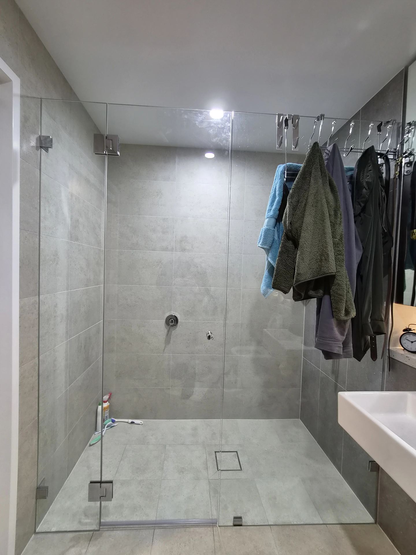 frameless shower screen with chrome hardware installed in Rouse Hill by Showerland