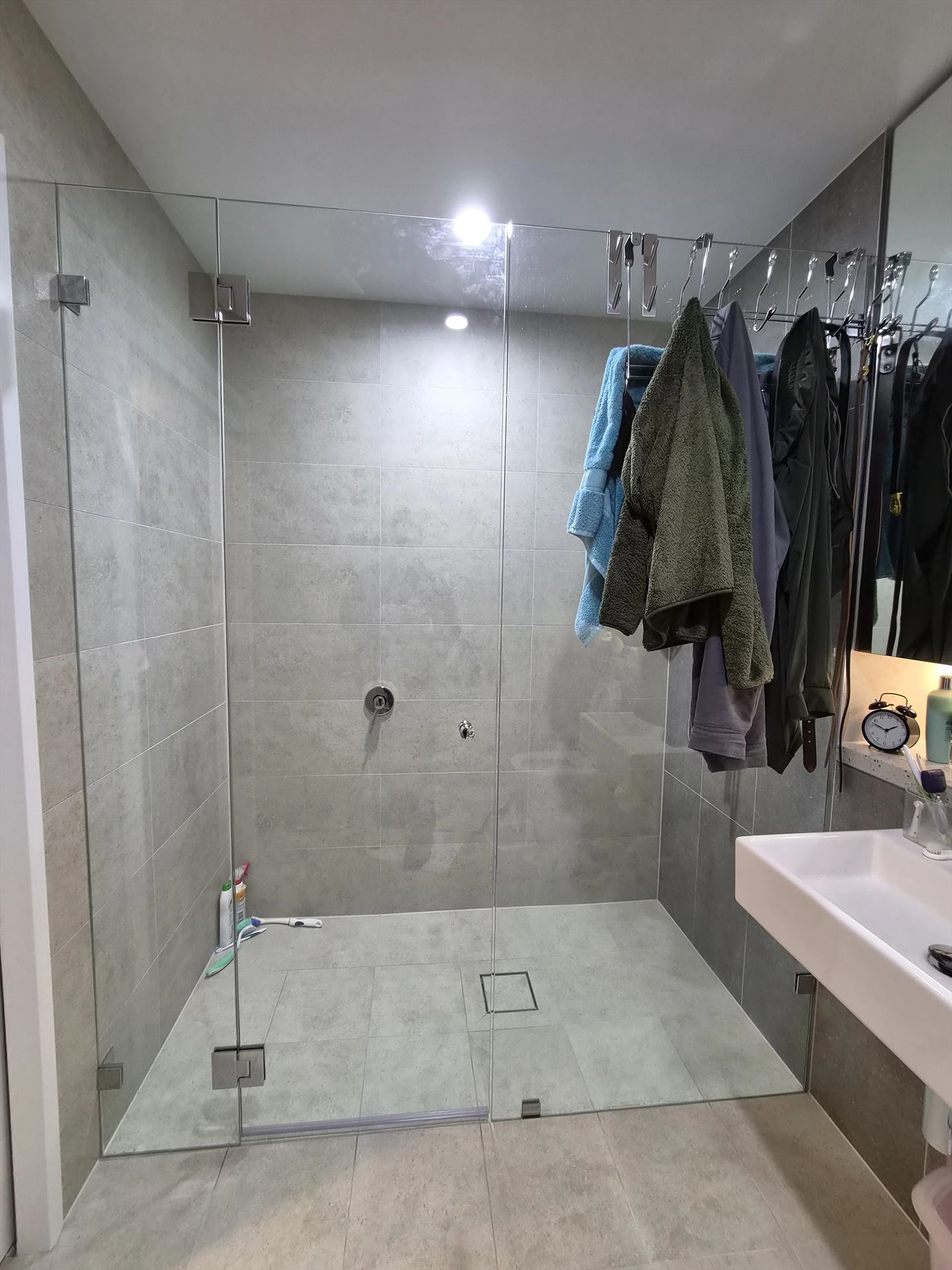 frameless shower screen with chrome hardware installed in Rouse Hill by Showerland