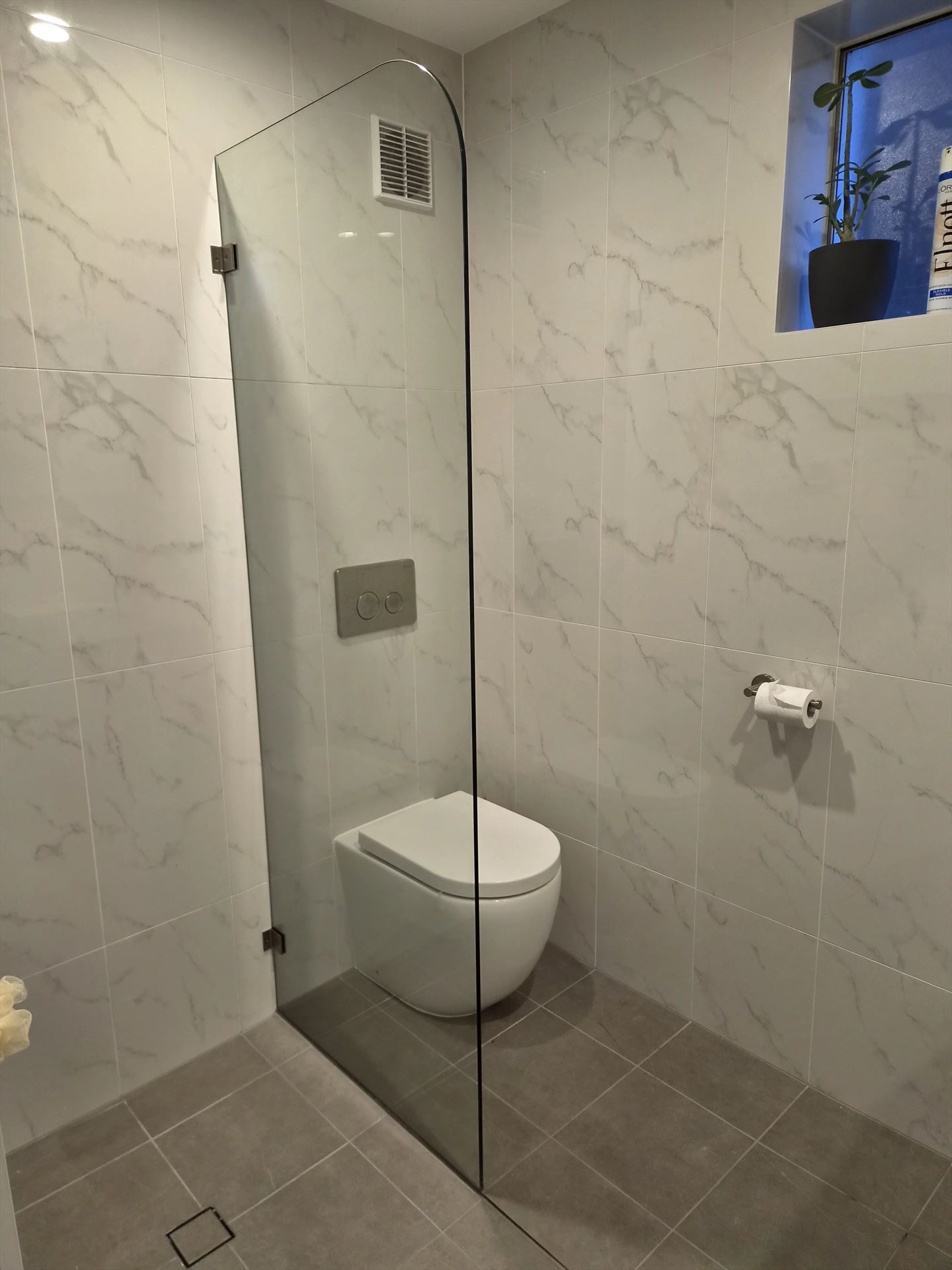 frameless shower screen with chrome hardware installed in North Rocks by Showerland