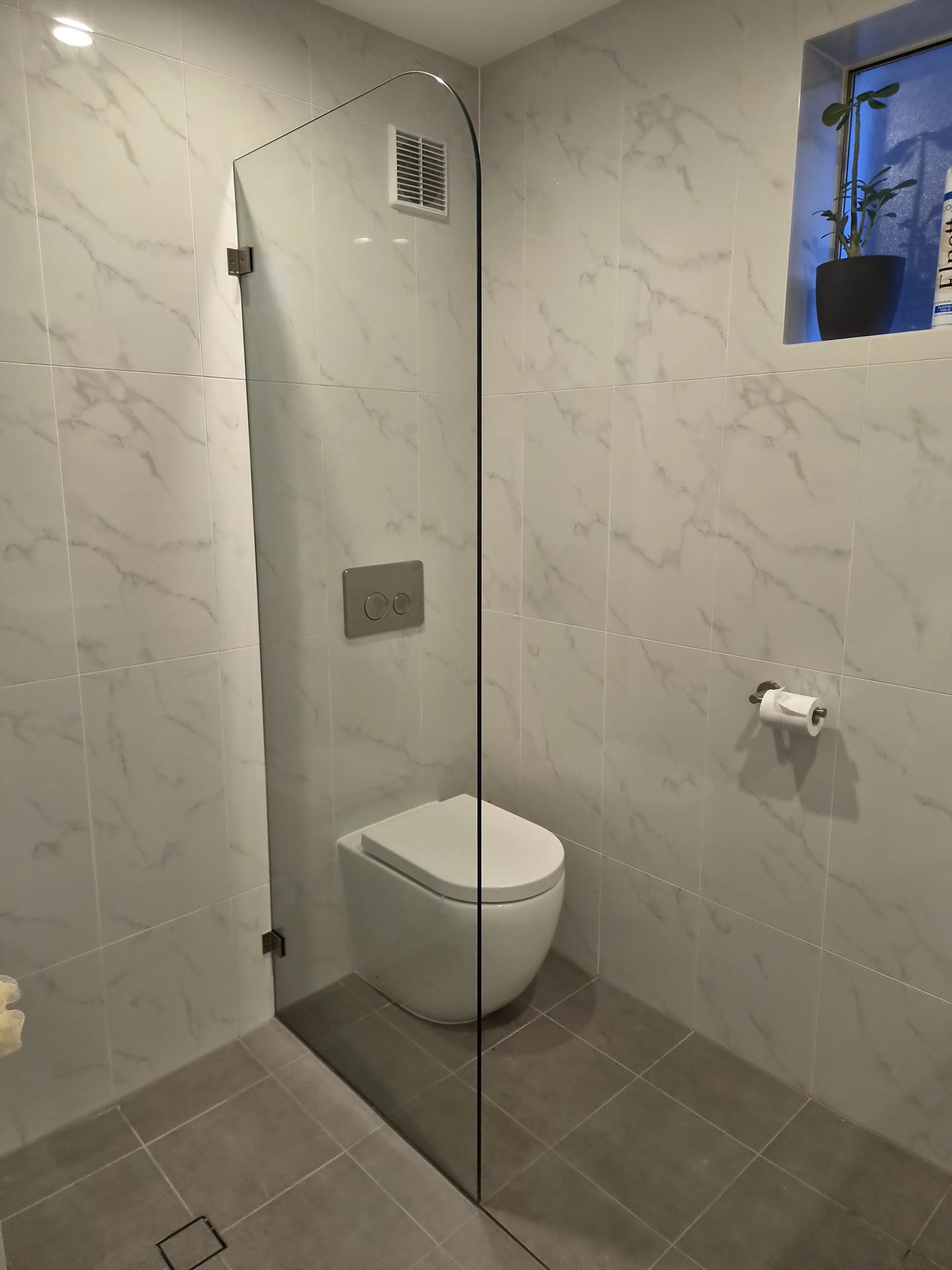 frameless shower screen with chrome hardware installed in North Rocks by Showerland