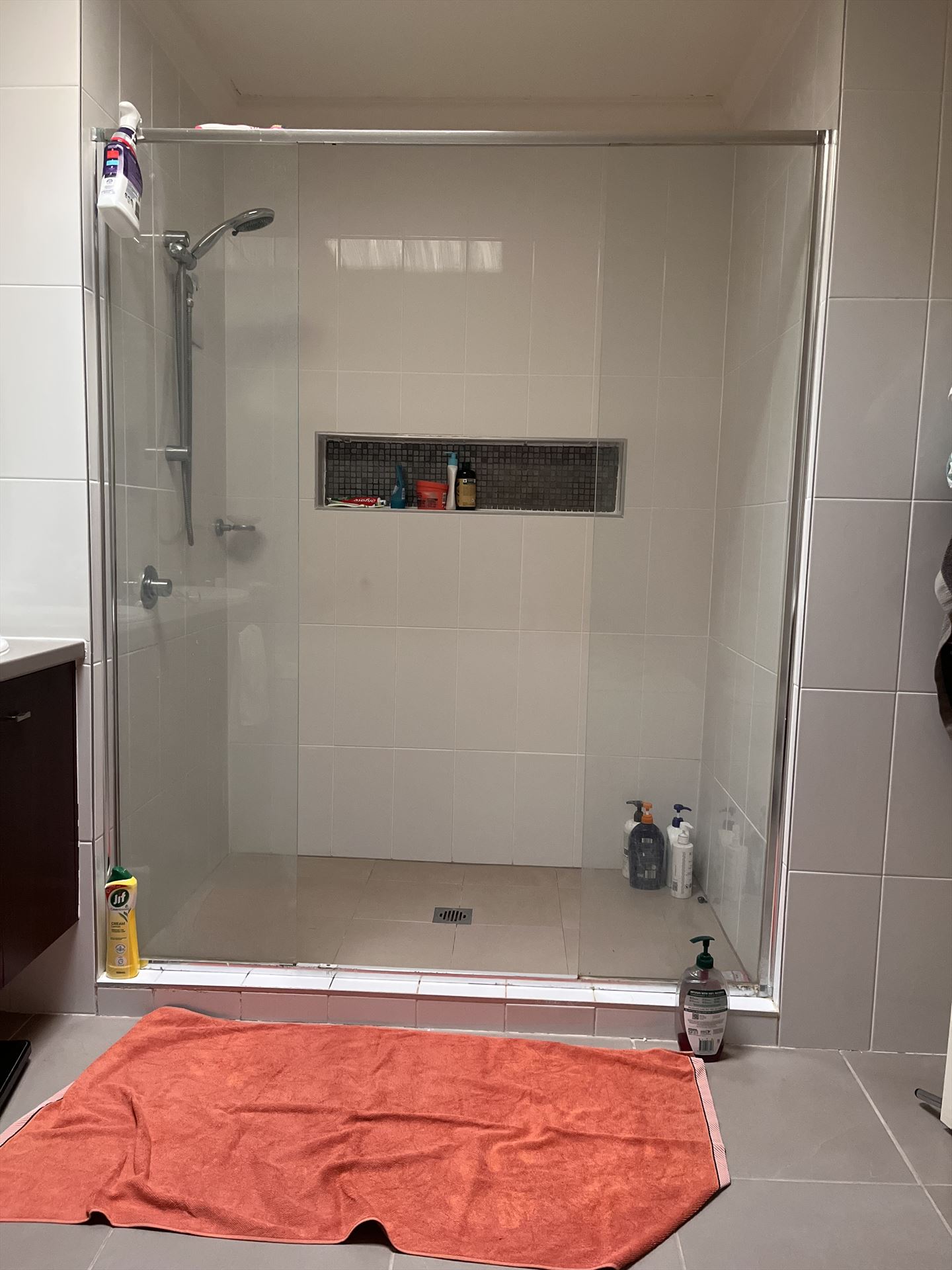frameless shower screen with chrome hardware installed in Kellyville by Showerland