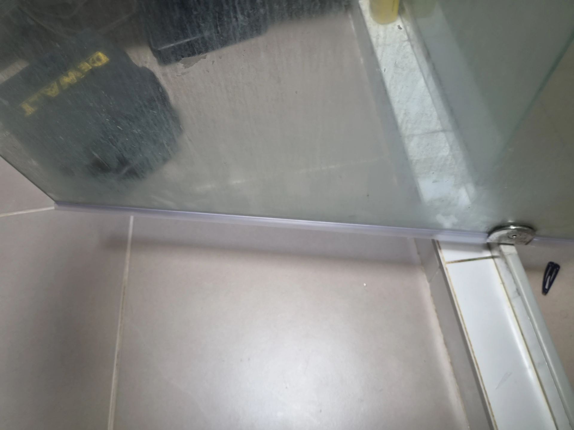 semi shower screen with chrome hardware installed in Kellyville by Showerland