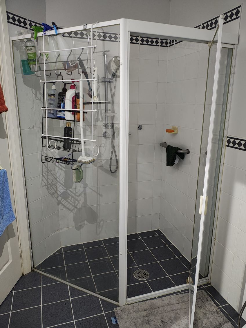 fully shower screen with white hardware installed in Greystanes by Showerland