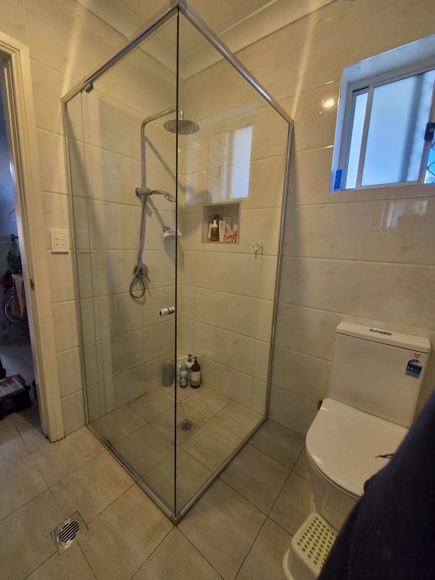 frameless shower screen with chrome hardware installed in West Ryde by Showerland