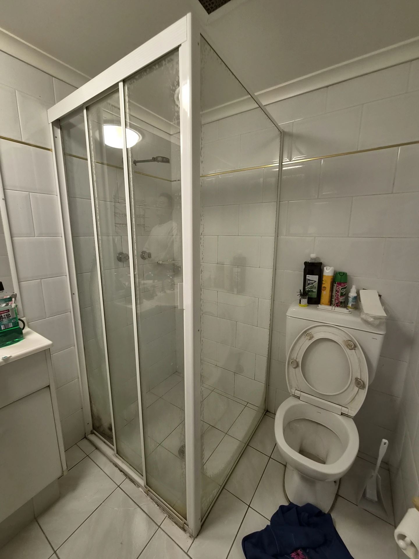 fully shower screen with white hardware installed in Sydney by Showerland