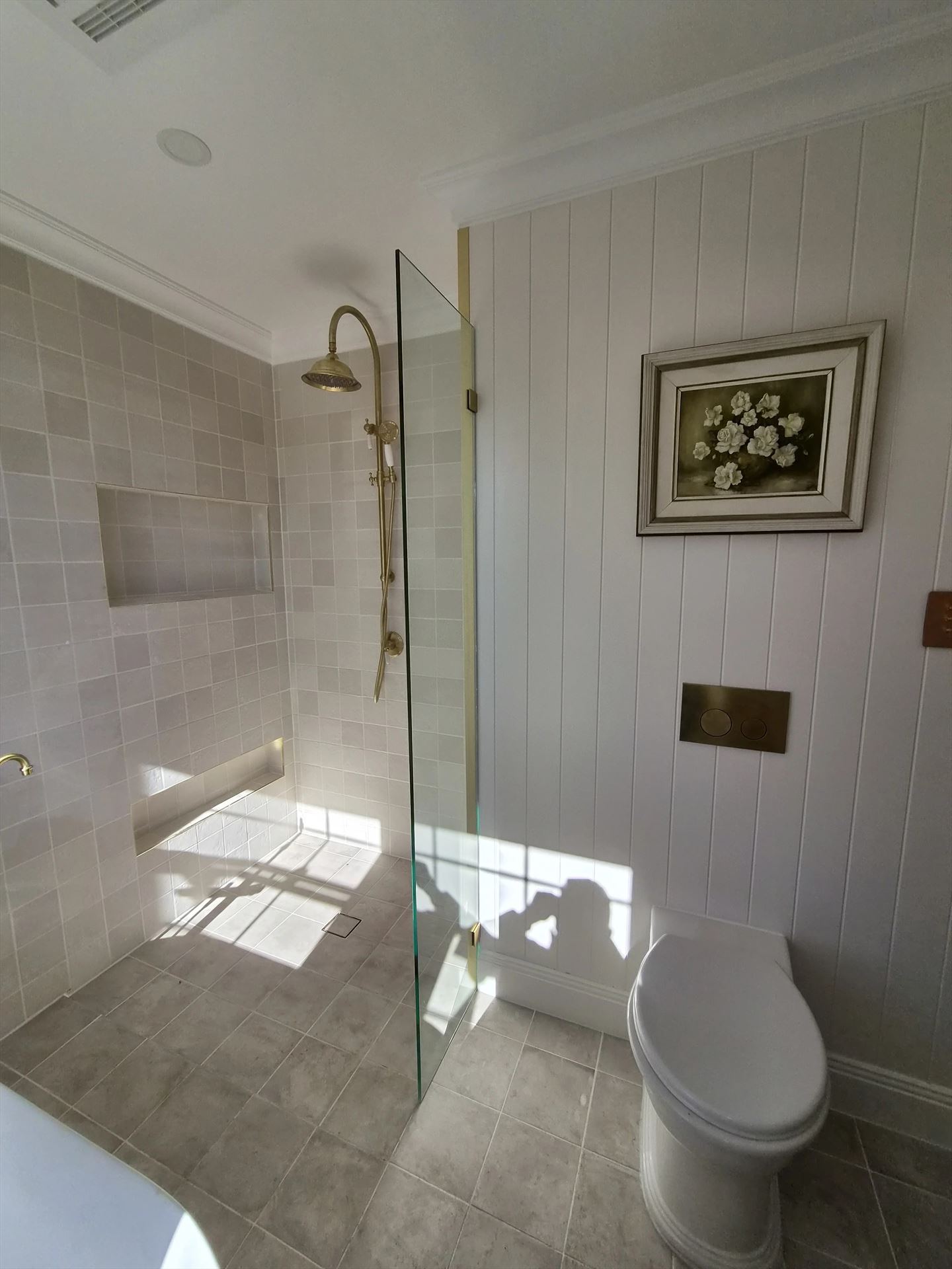 frameless shower screen with gold hardware installed in Blacktown by Showerland