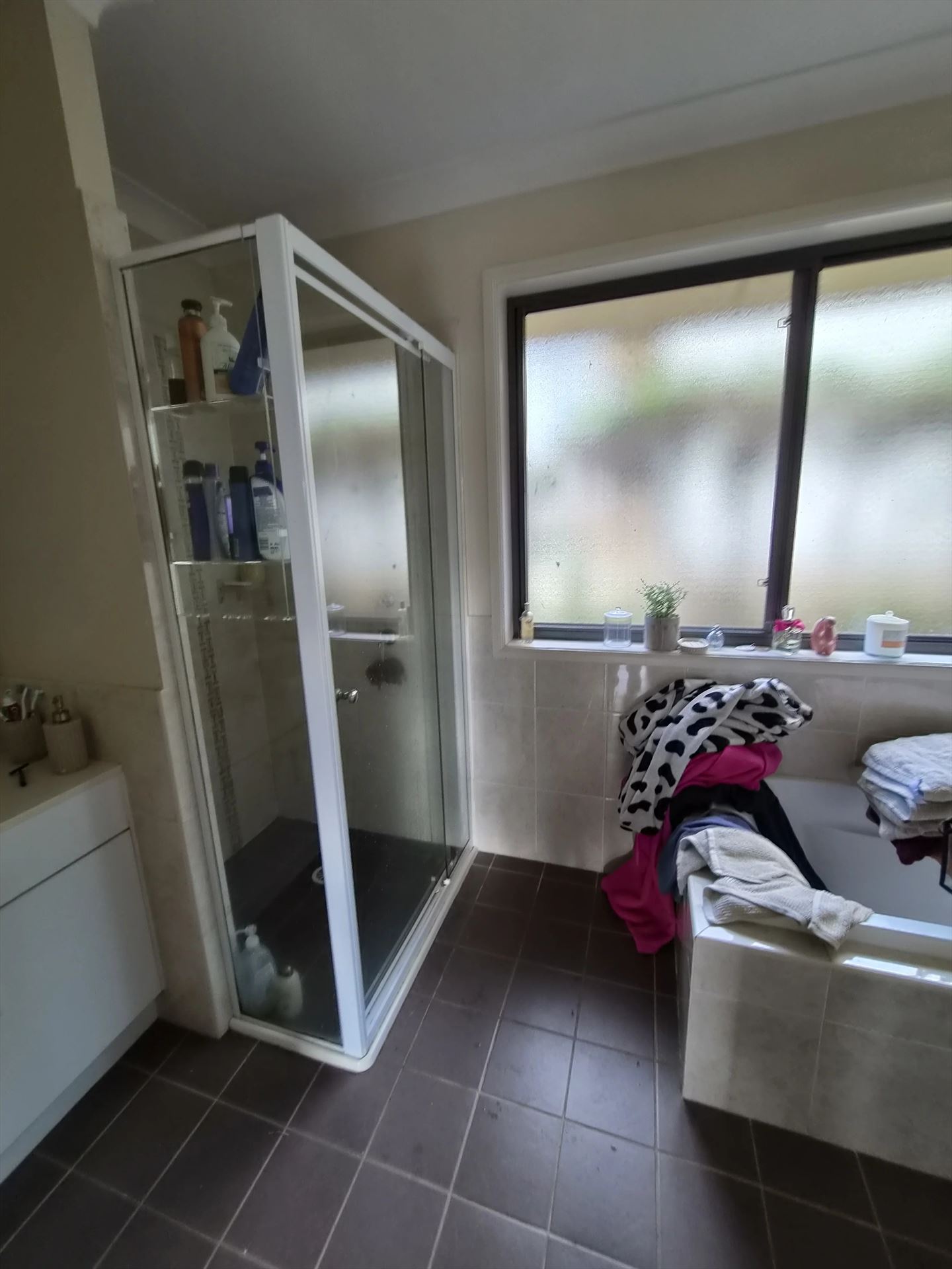 fully shower screen with white hardware installed in Asquith by Showerland