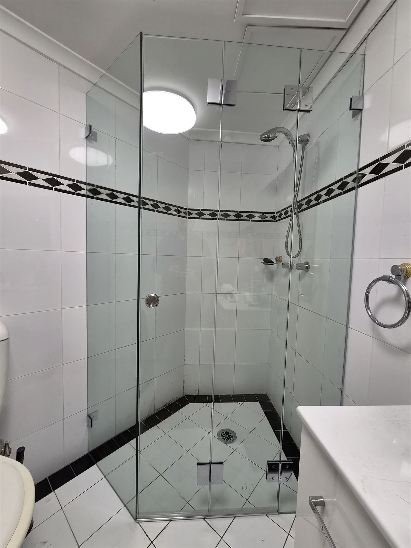 frameless shower screen with chrome hardware installed in Strathfield by Showerland