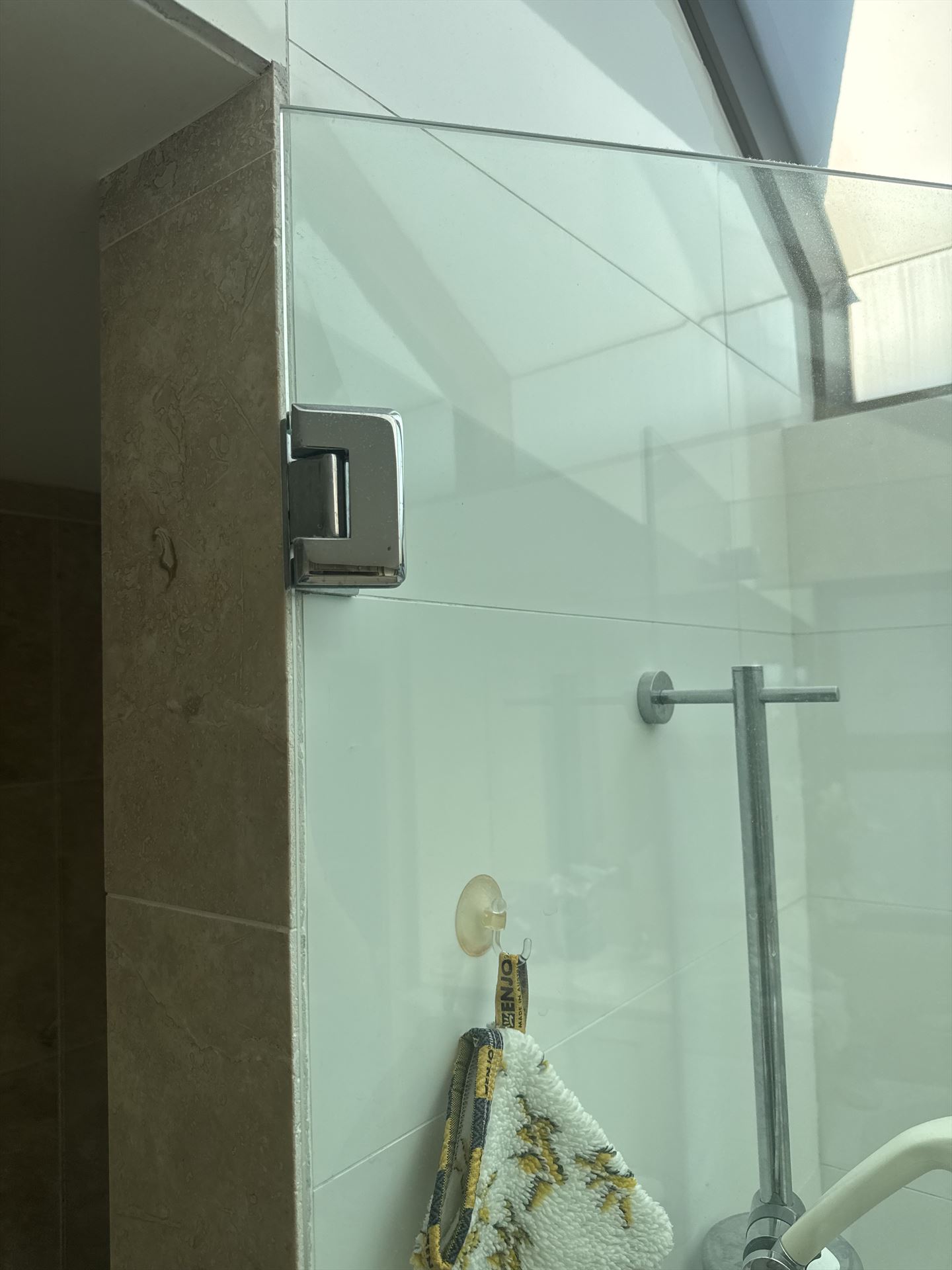 frameless shower screen with chrome hardware installed in Cremorne by Showerland