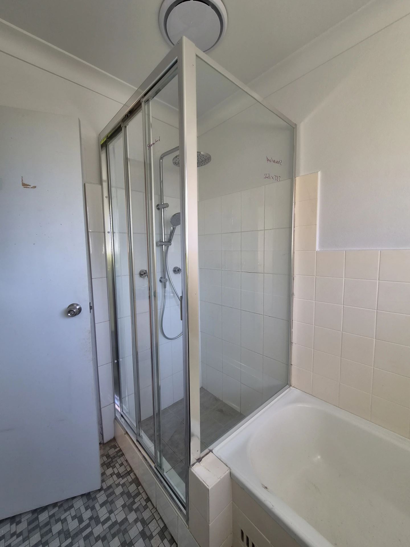 fully shower screen with white hardware installed in North Parramatta by Showerland