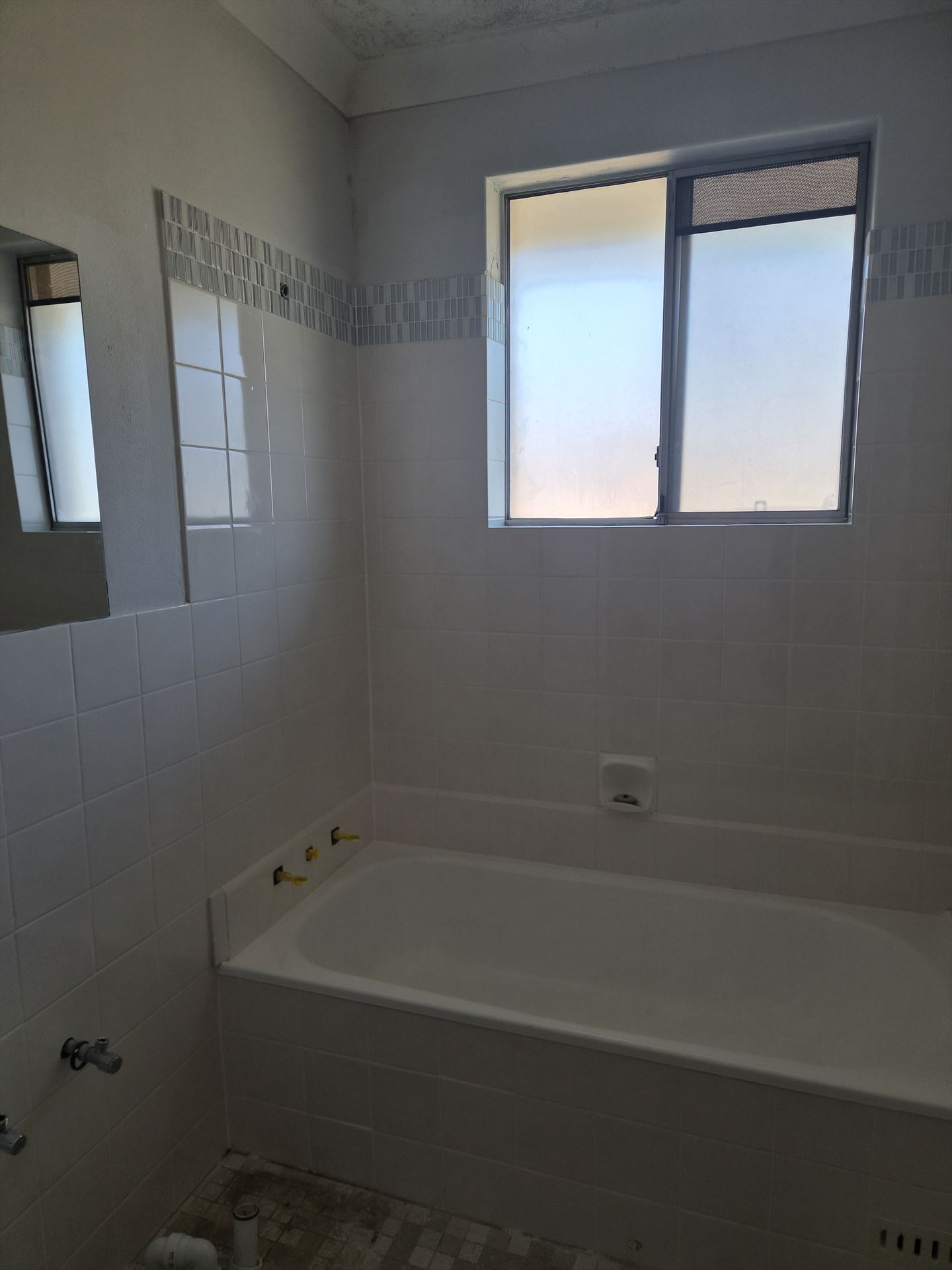 Bathroom before frameless shower screen install in Mount Druitt
