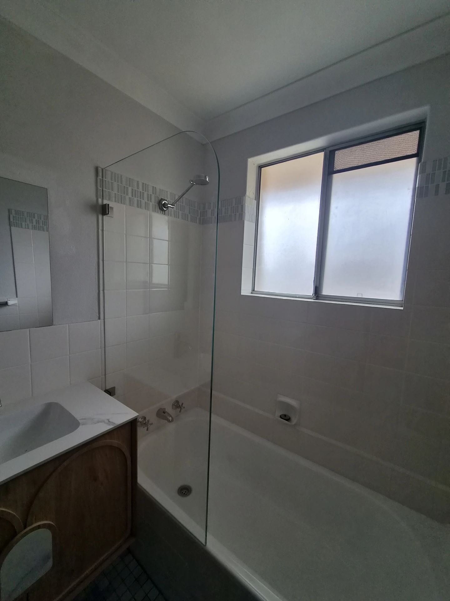frameless shower screen with chrome hardware installed in Mount Druitt by Showerland