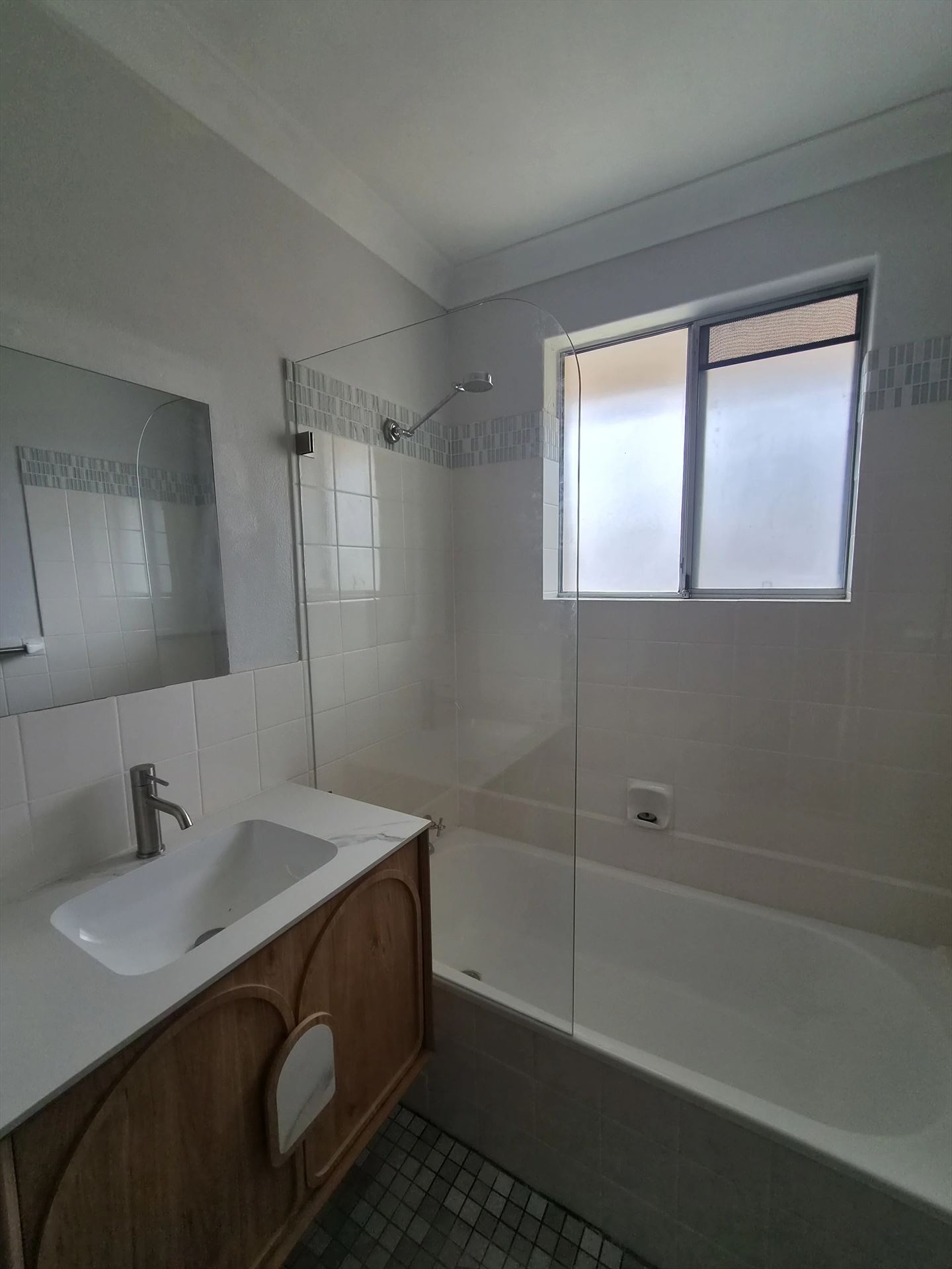 frameless shower screen with chrome hardware installed in Mount Druitt by Showerland