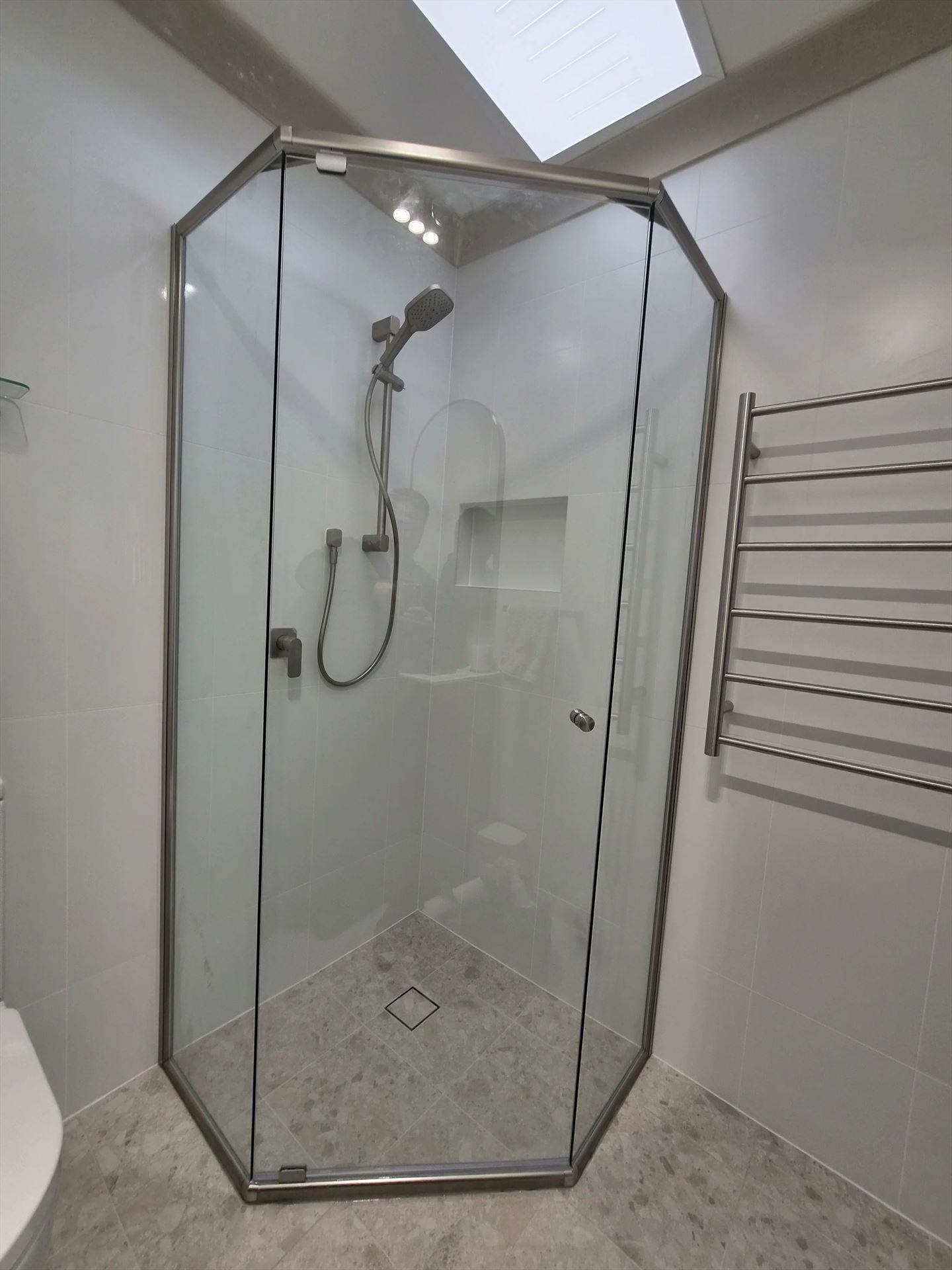 semi shower screen with chrome hardware installed in Engadine by Showerland