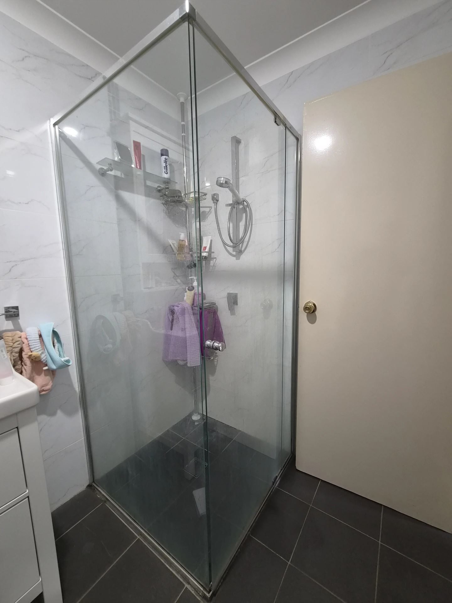 frameless shower screen with chrome hardware installed in Blacktown by Showerland