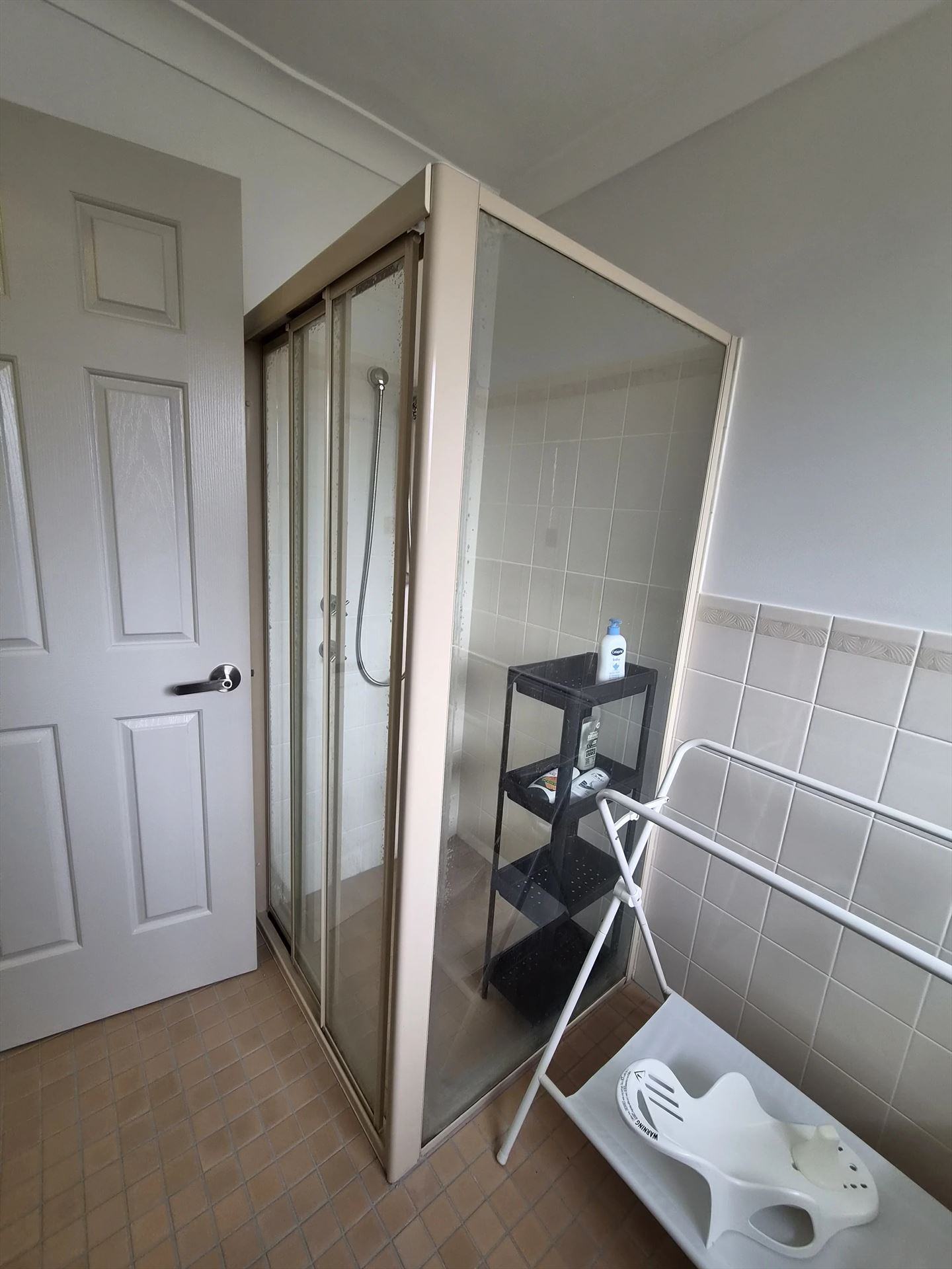 fully shower screen with white hardware installed in Quakers Hill by Showerland