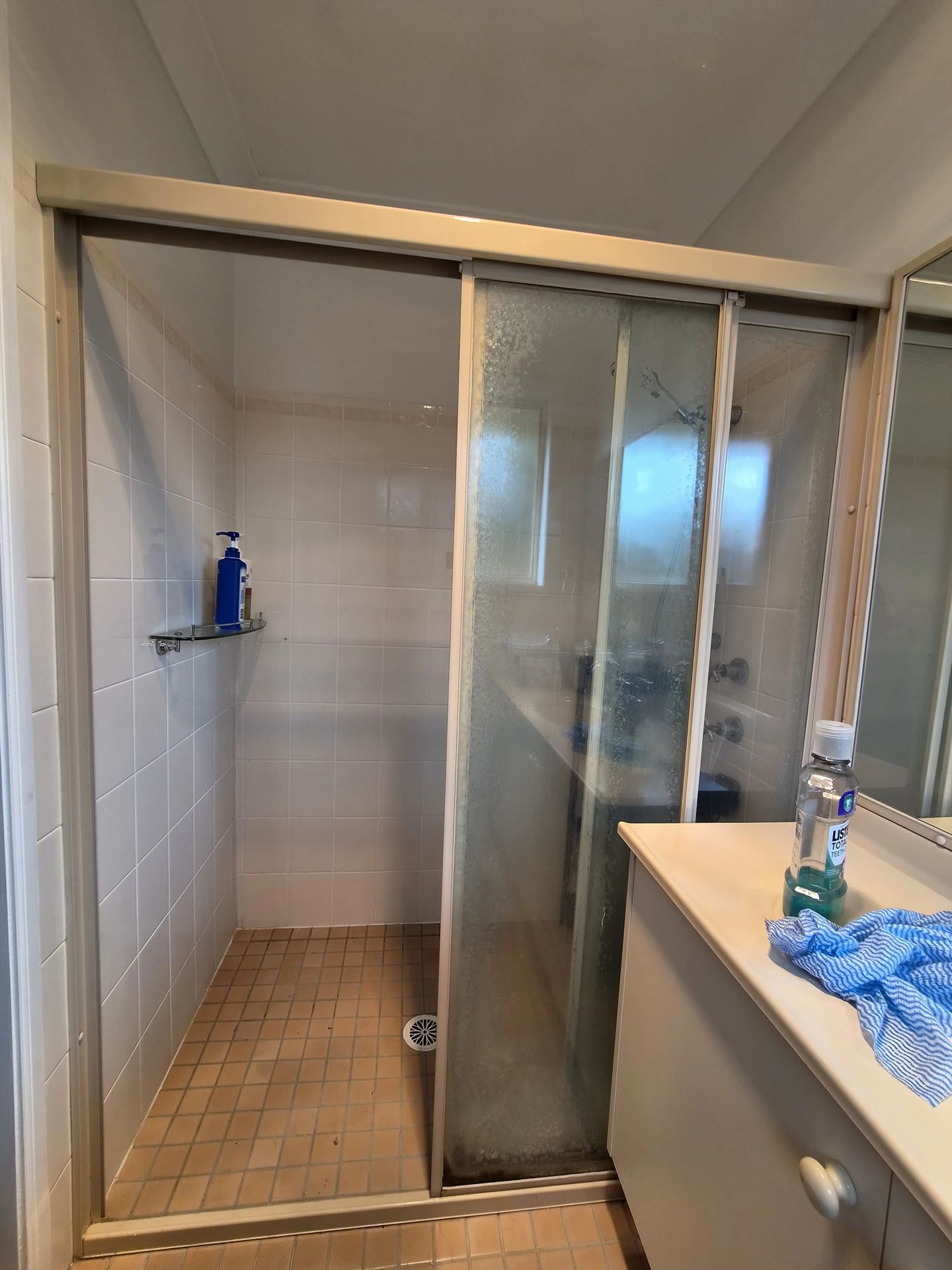 fully shower screen with white hardware installed in Quakers Hill by Showerland