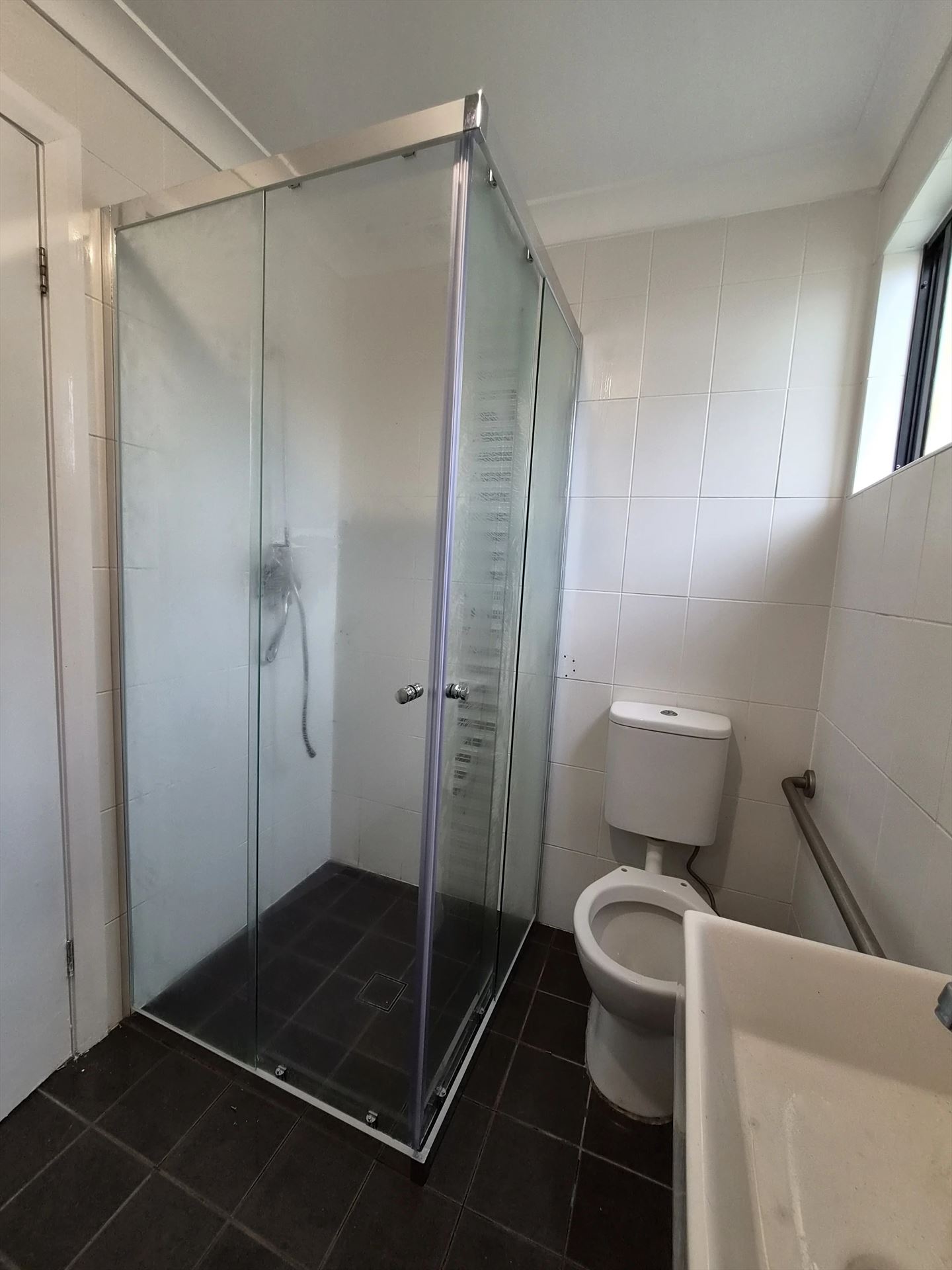 fully shower screen with chrome hardware installed in Georges Hall by Showerland
