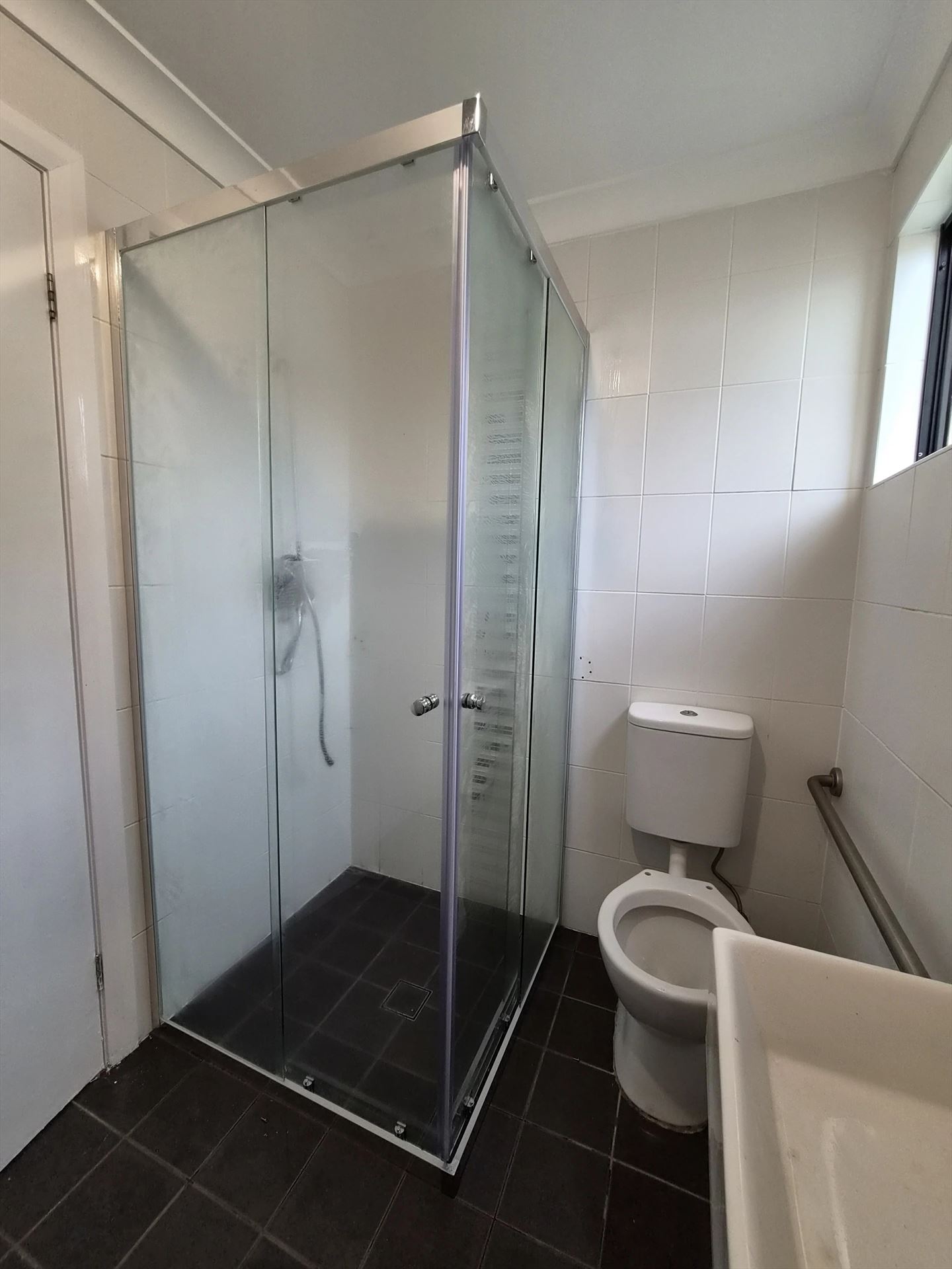 fully shower screen with chrome hardware installed in Georges Hall by Showerland