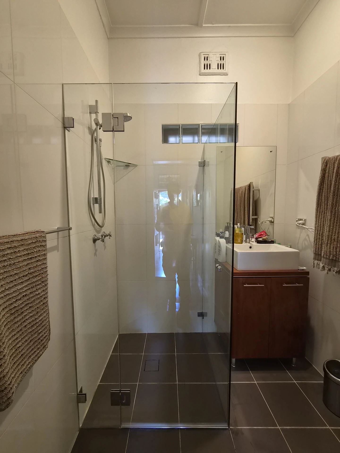 frameless shower screen with chrome hardware installed in Haberfield by Showerland