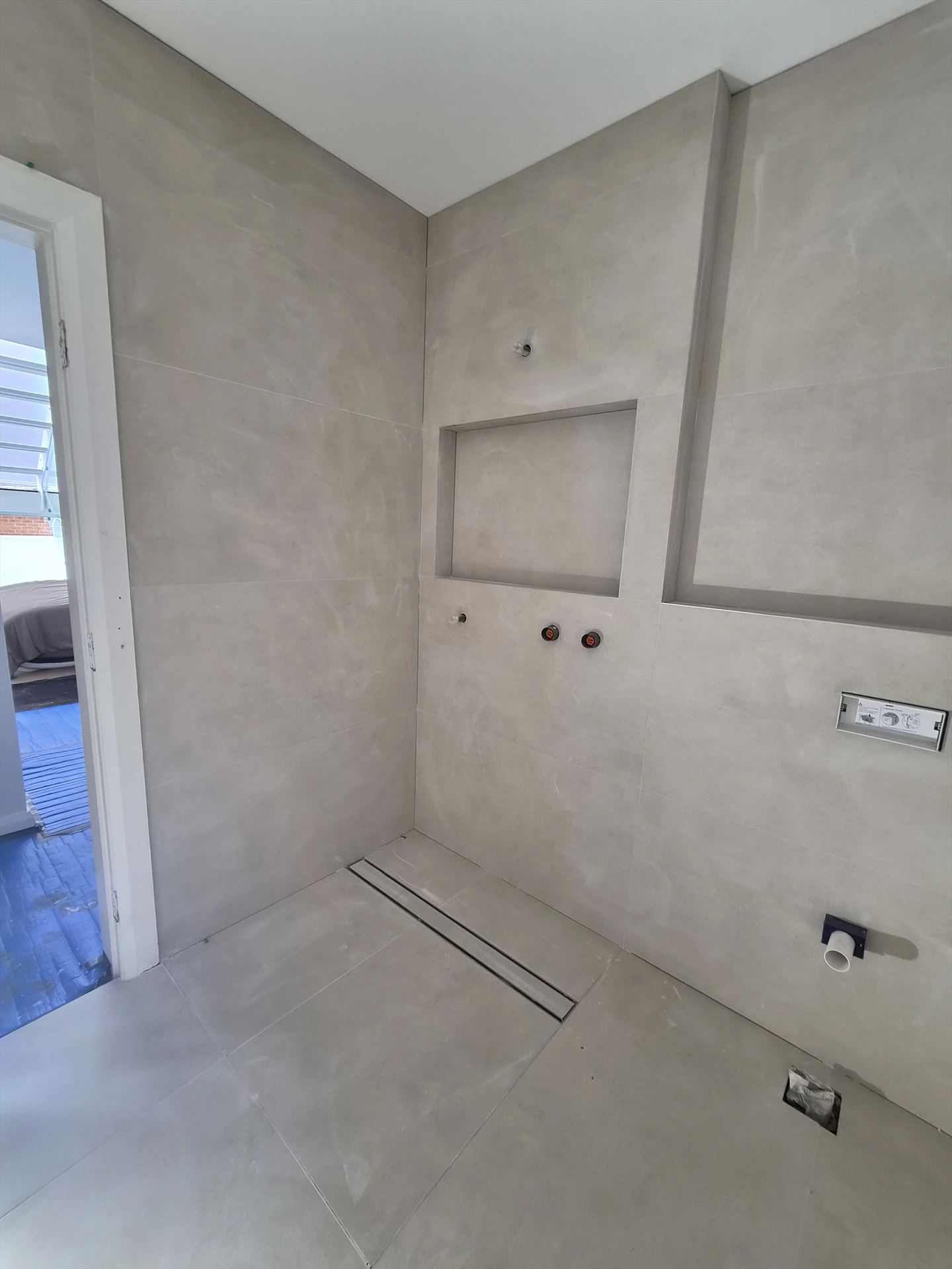 Bathroom before frameless shower screen install in Rodd Point