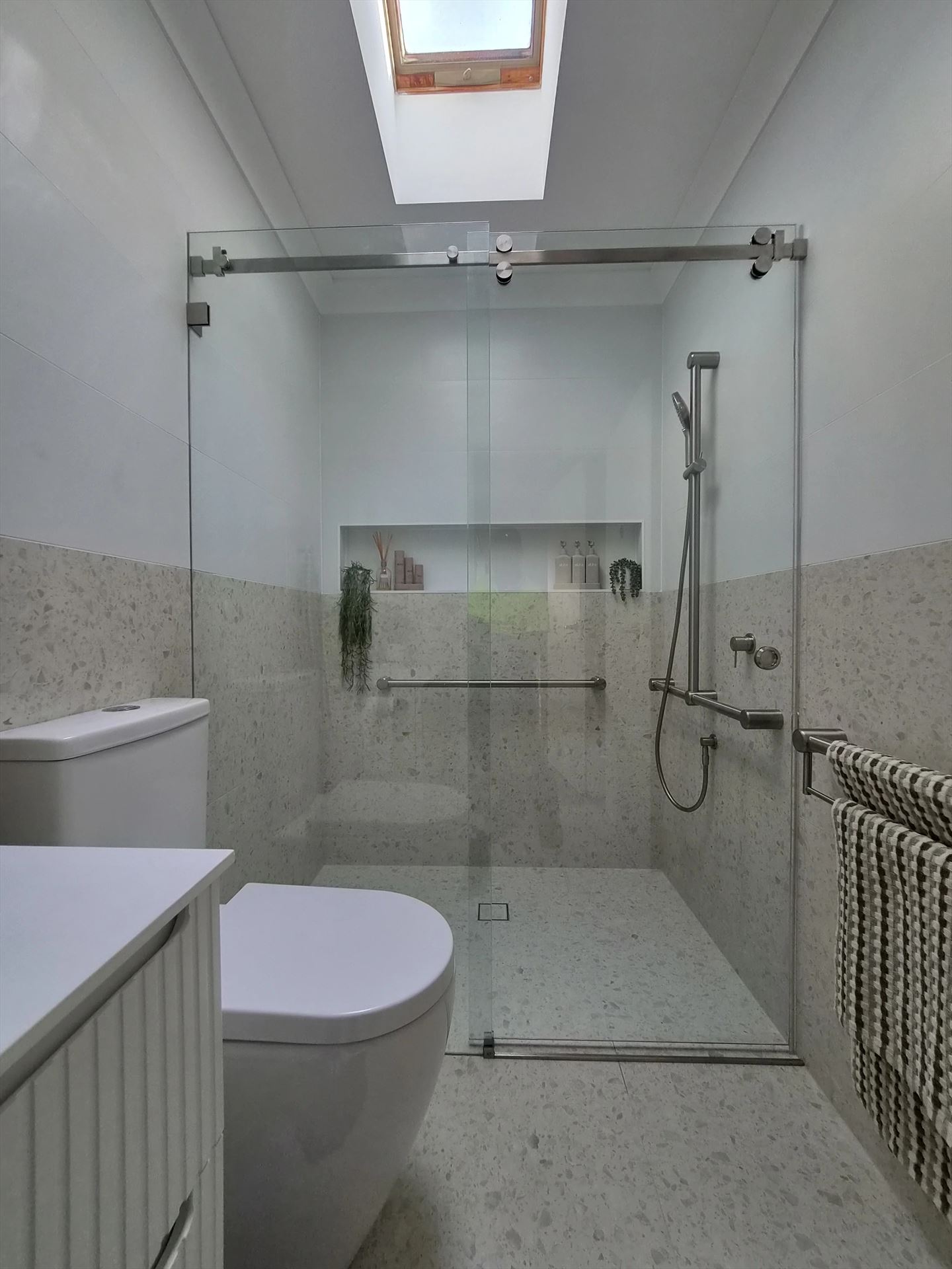 frameless shower screen with chrome hardware installed in Northmead by Showerland