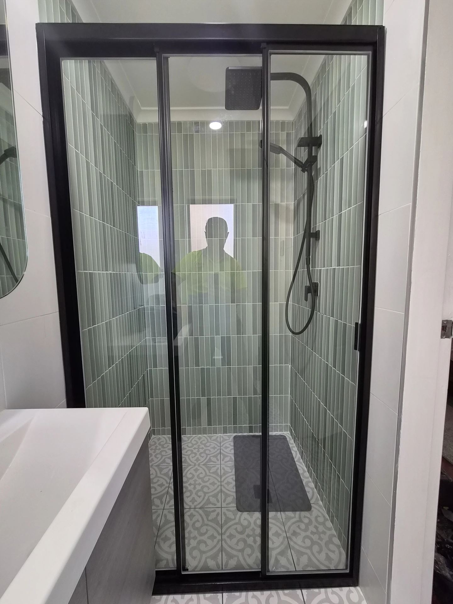 semi shower screen with black hardware installed in Taren Point by Showerland