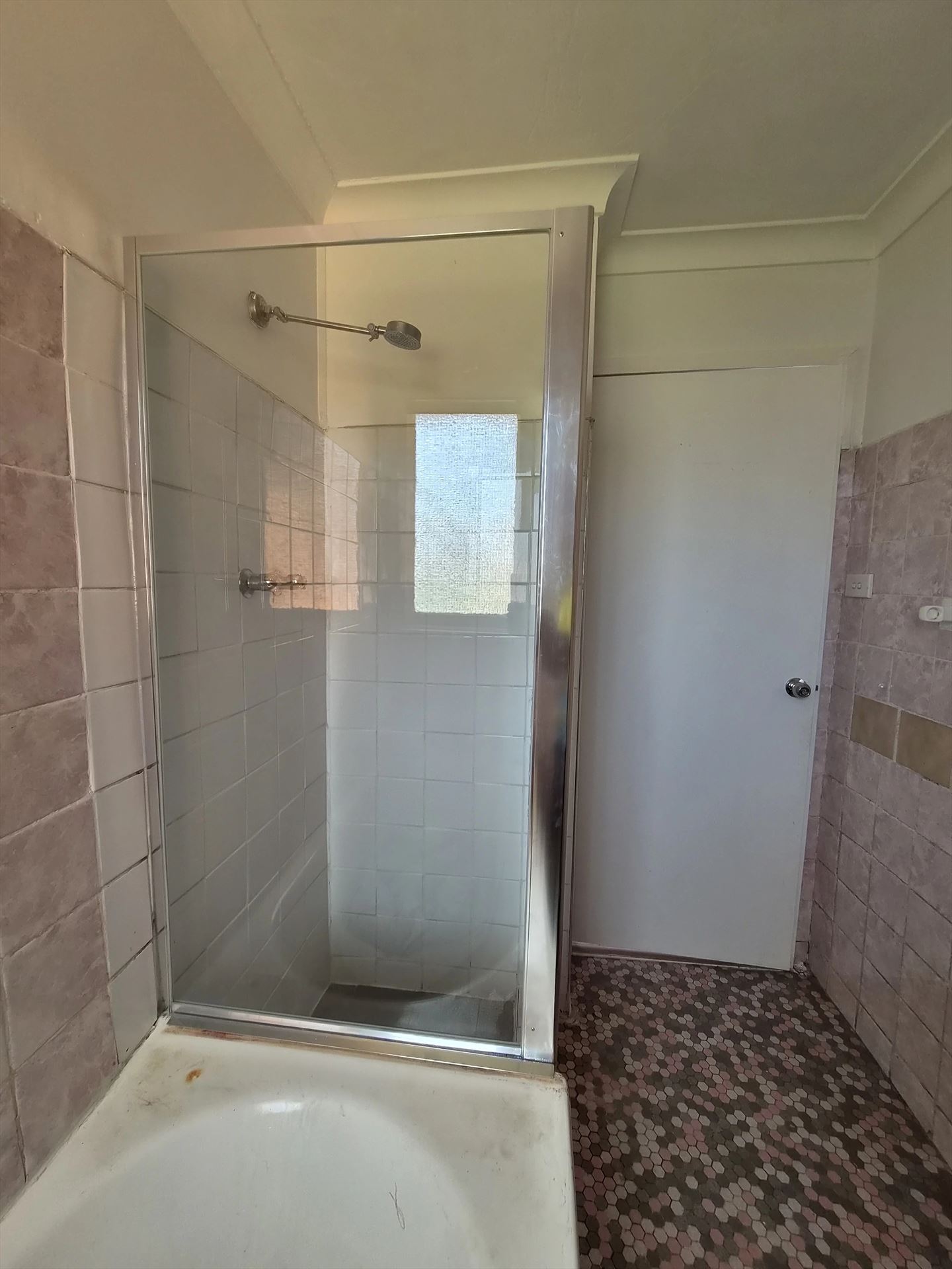 fully shower screen with chrome hardware installed in Seven Hills by Showerland
