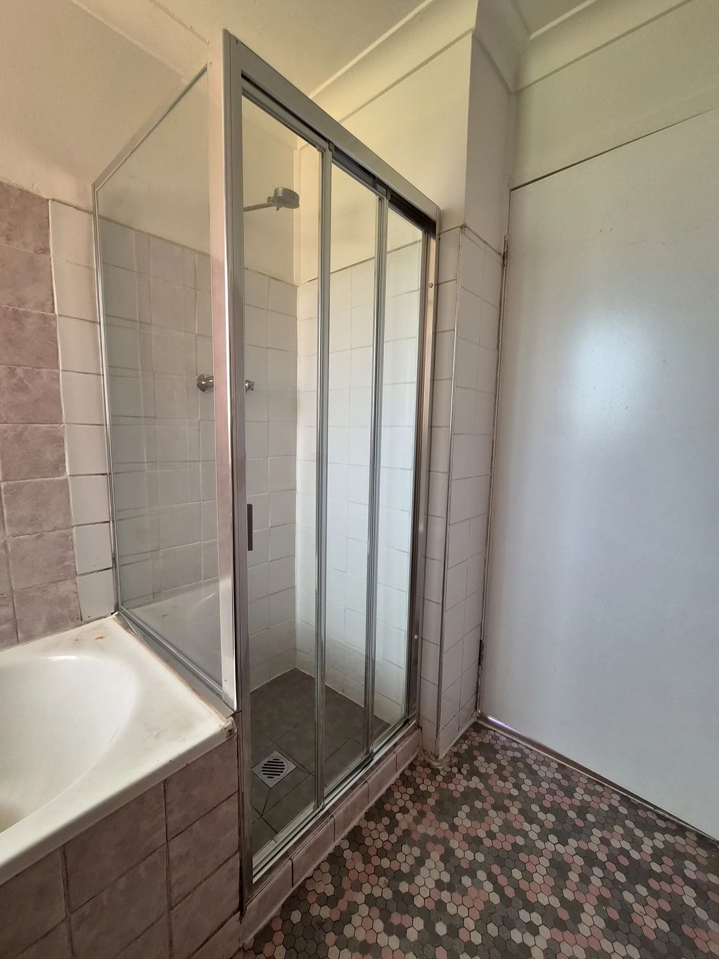 fully shower screen with chrome hardware installed in Seven Hills by Showerland