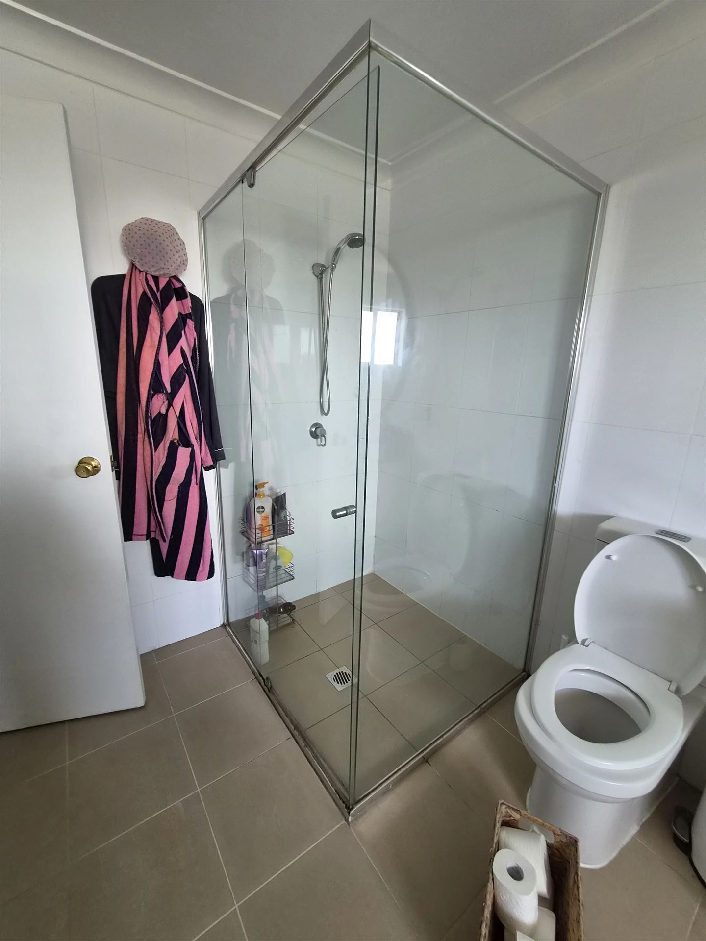 frameless shower screen with chrome hardware installed in Sydney by Showerland