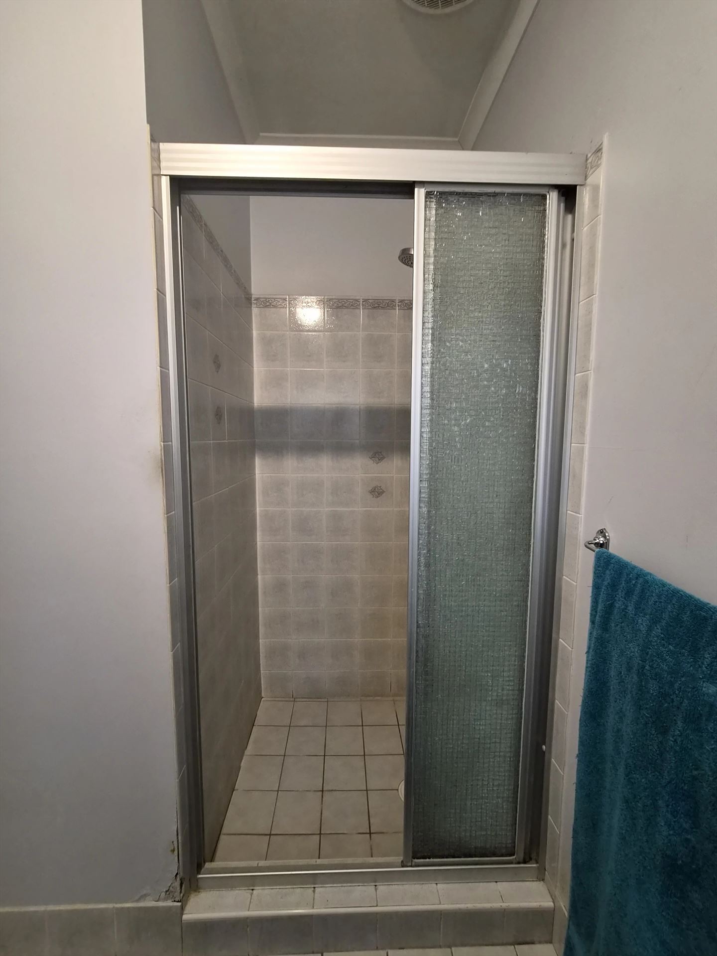 fully shower screen with chrome hardware installed in Hinchinbrook by Showerland