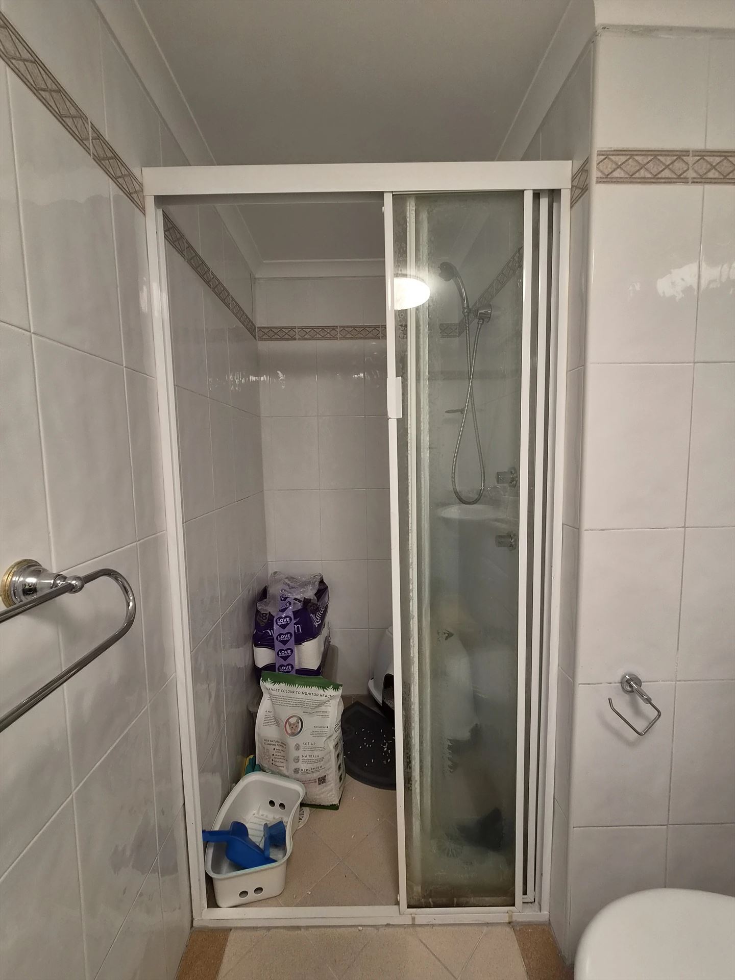 fully shower screen with white hardware installed in Sydney by Showerland