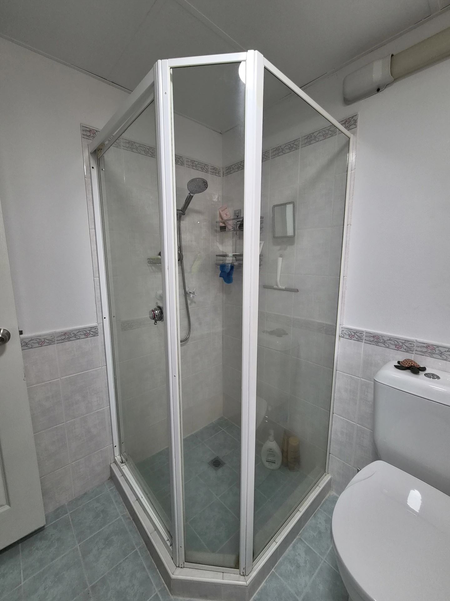 fully shower screen with white hardware installed in Sydney by Showerland