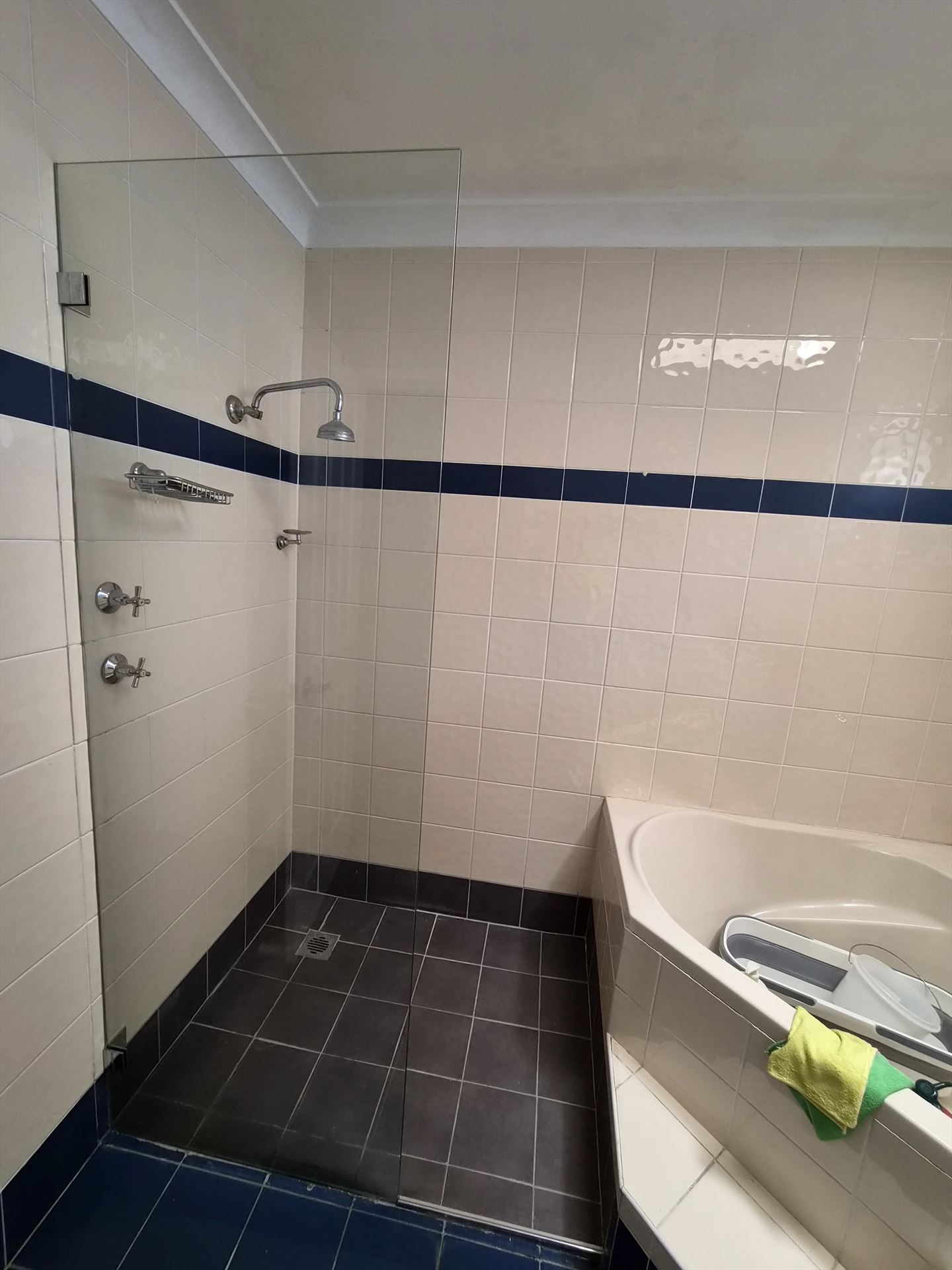 frameless shower screen with chrome hardware installed in Greystanes by Showerland